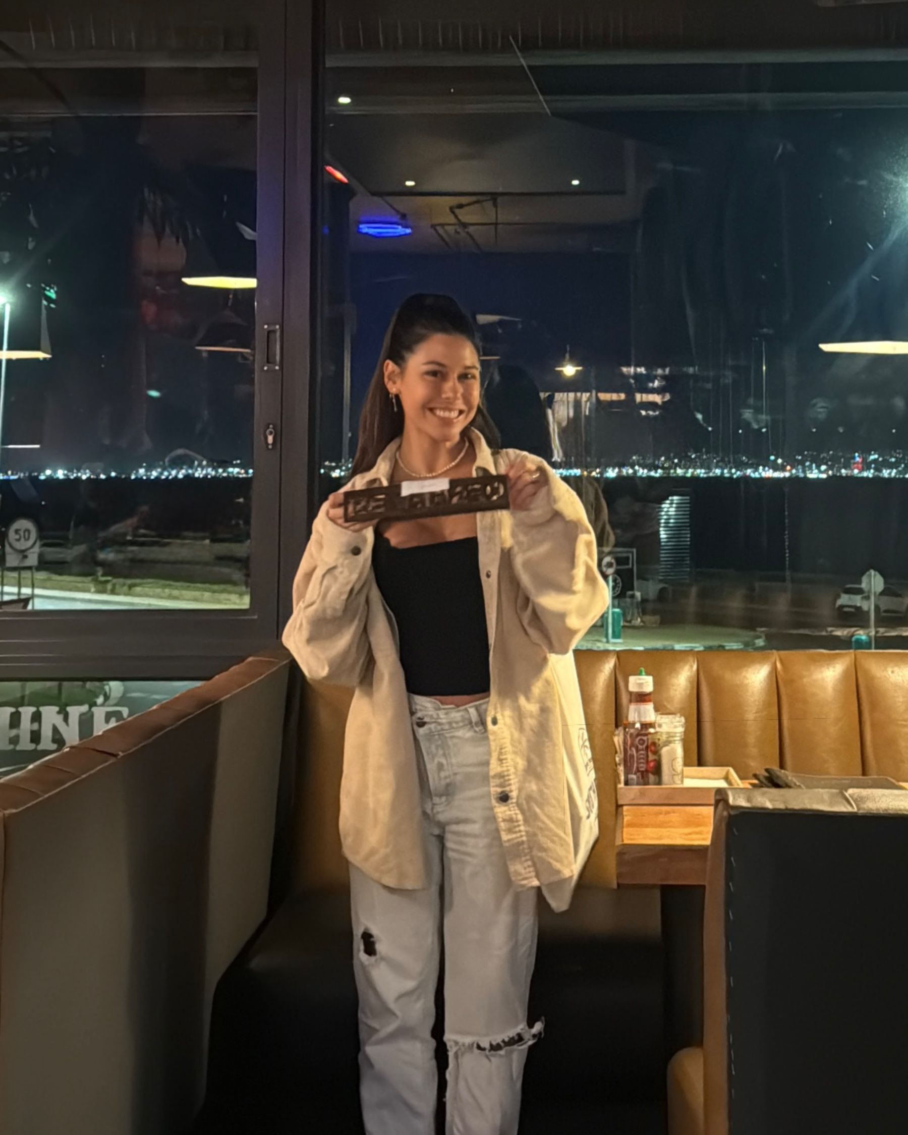 Paige standing inside Jerry’s restaurant in Blouberg
