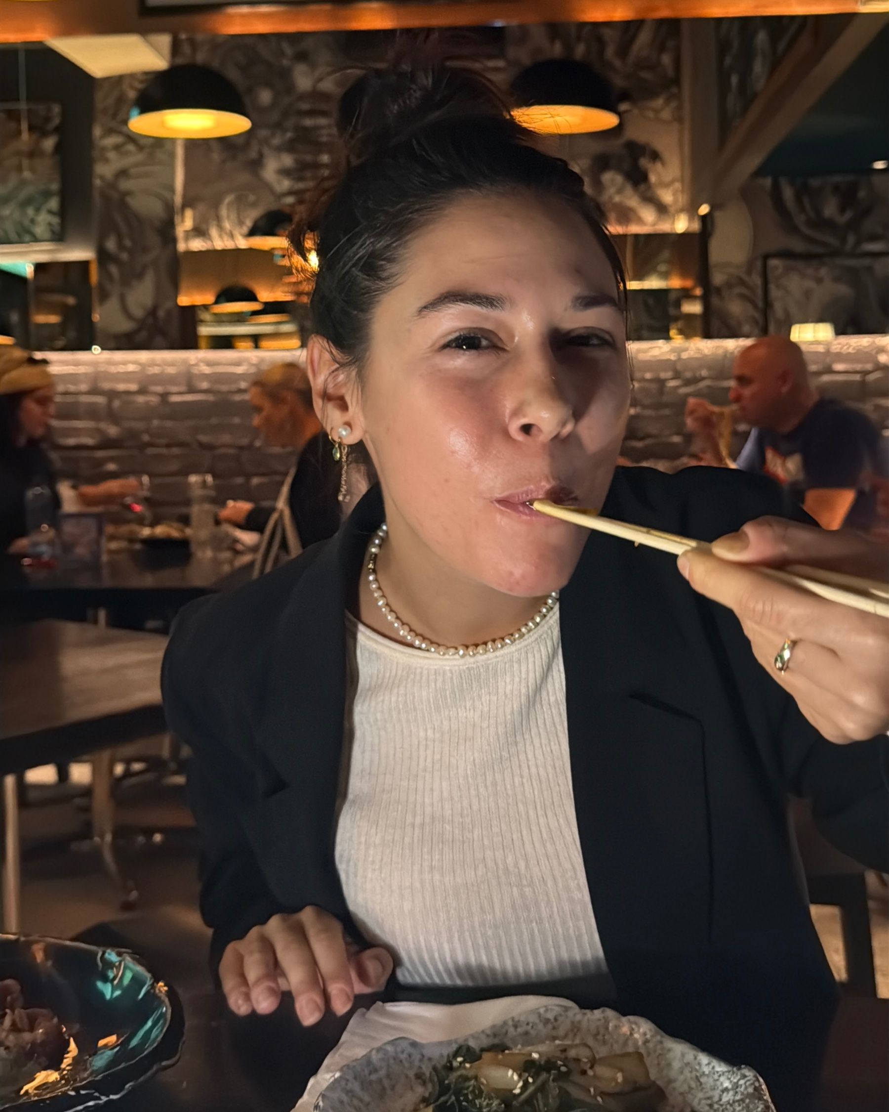 Paige is eating bok choy at Kanji Ramen