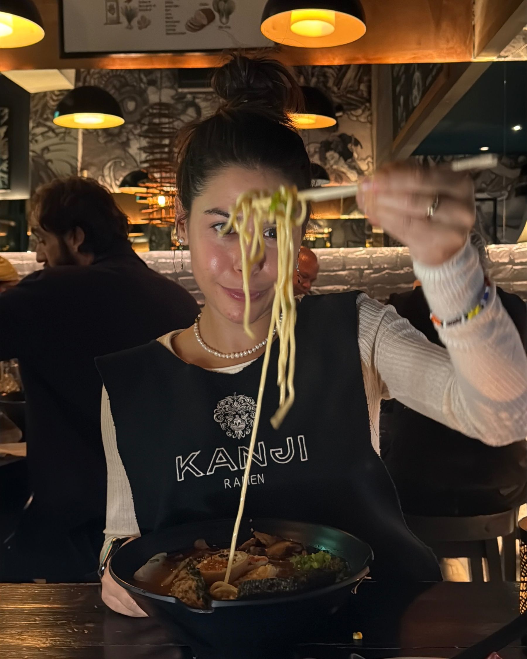 Paige is eating seafood ramen at Kanji Ramen