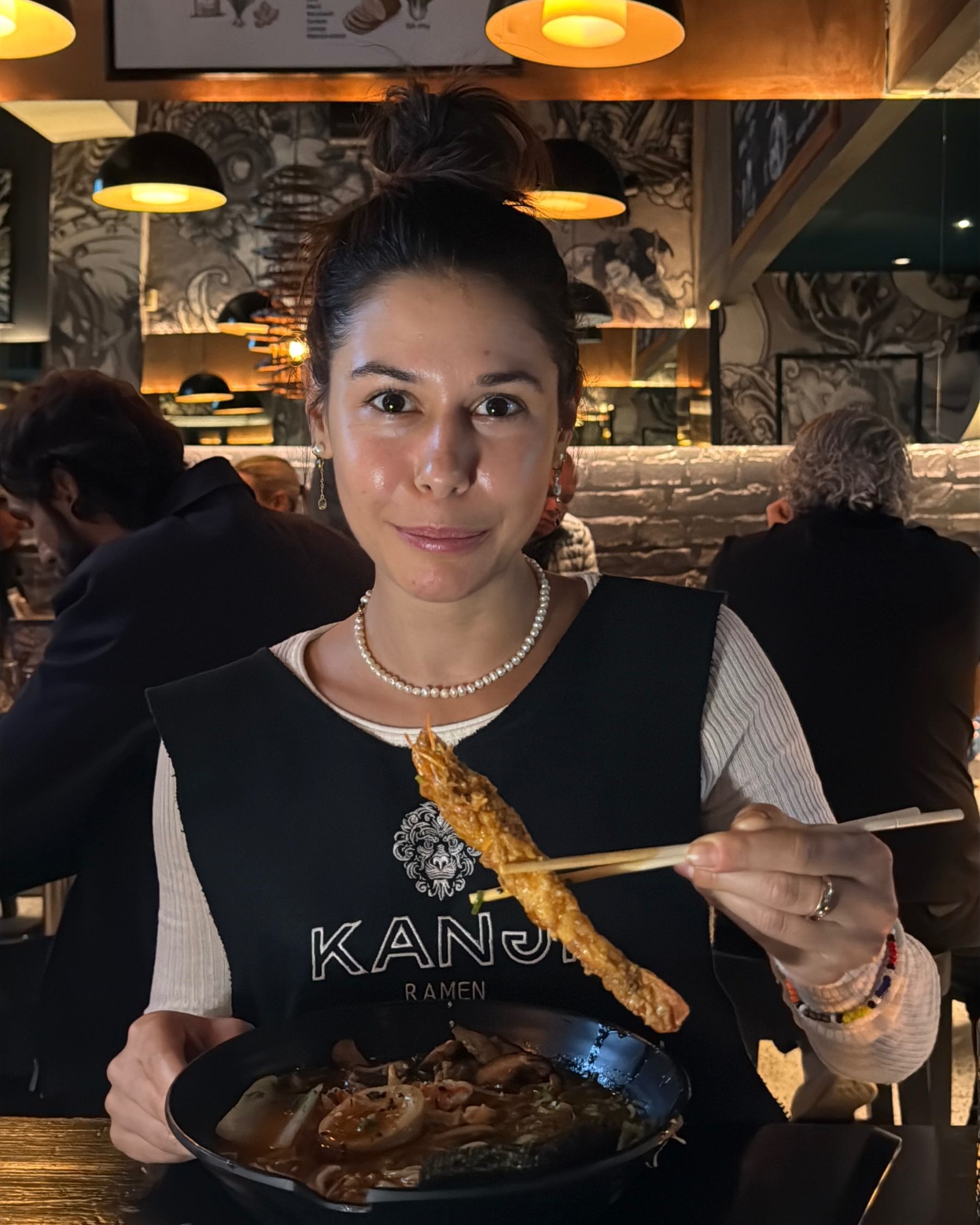 Paige is eating tempura prawn ramen at Kanji Ramen