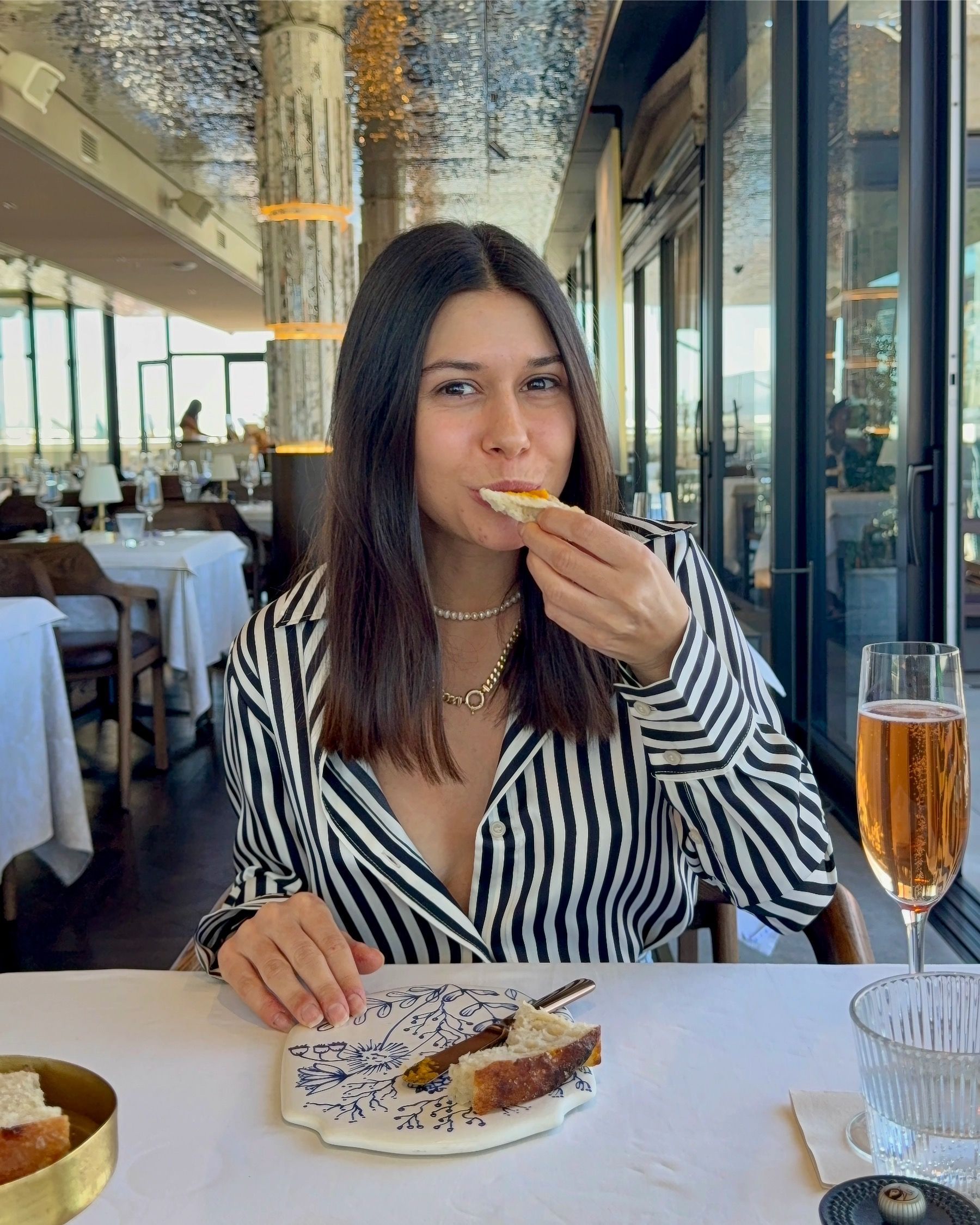 Paige enjoying rustic bread with pumpkin purée at Marble Cape Town V&A Waterfront.
