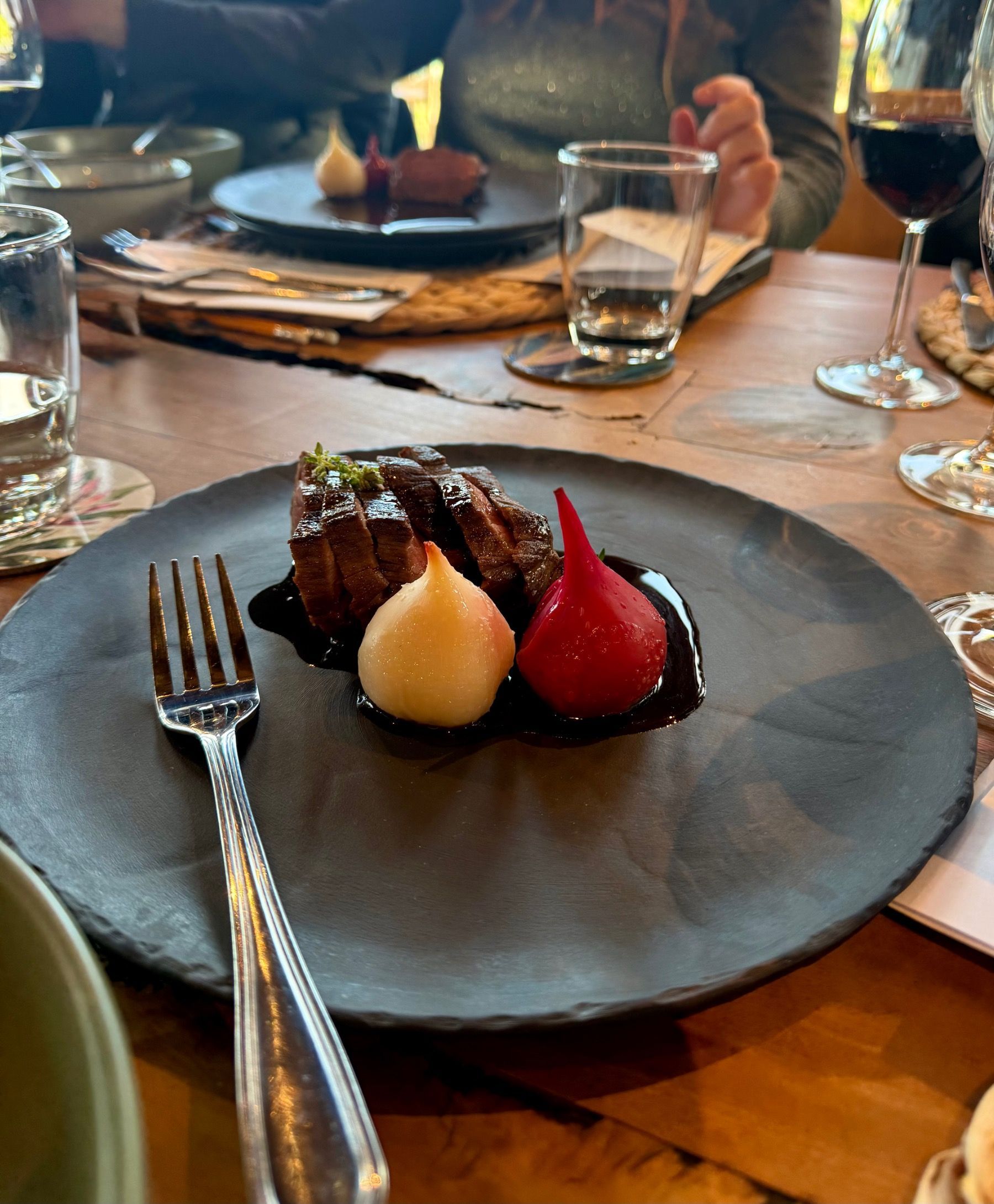 Lightly smoked ostrich with tart jus and roasted beetroot paired with Painted Wolf Pictus VII red blend at Meuse Farm