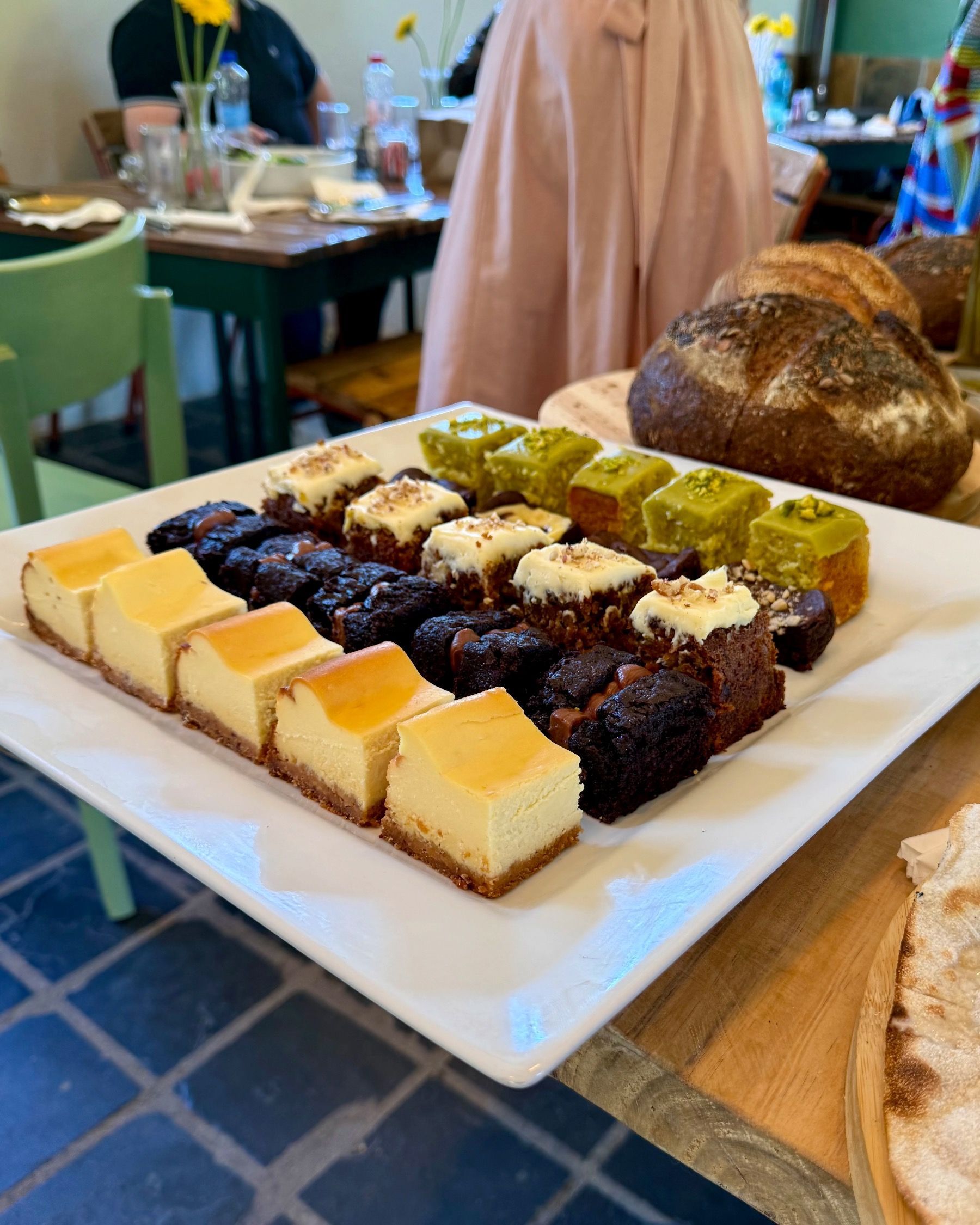 Assorted house-made desserts at Motherdough Jonkershoek launch, layered slices and baked sweets displayed in Stellenbosch