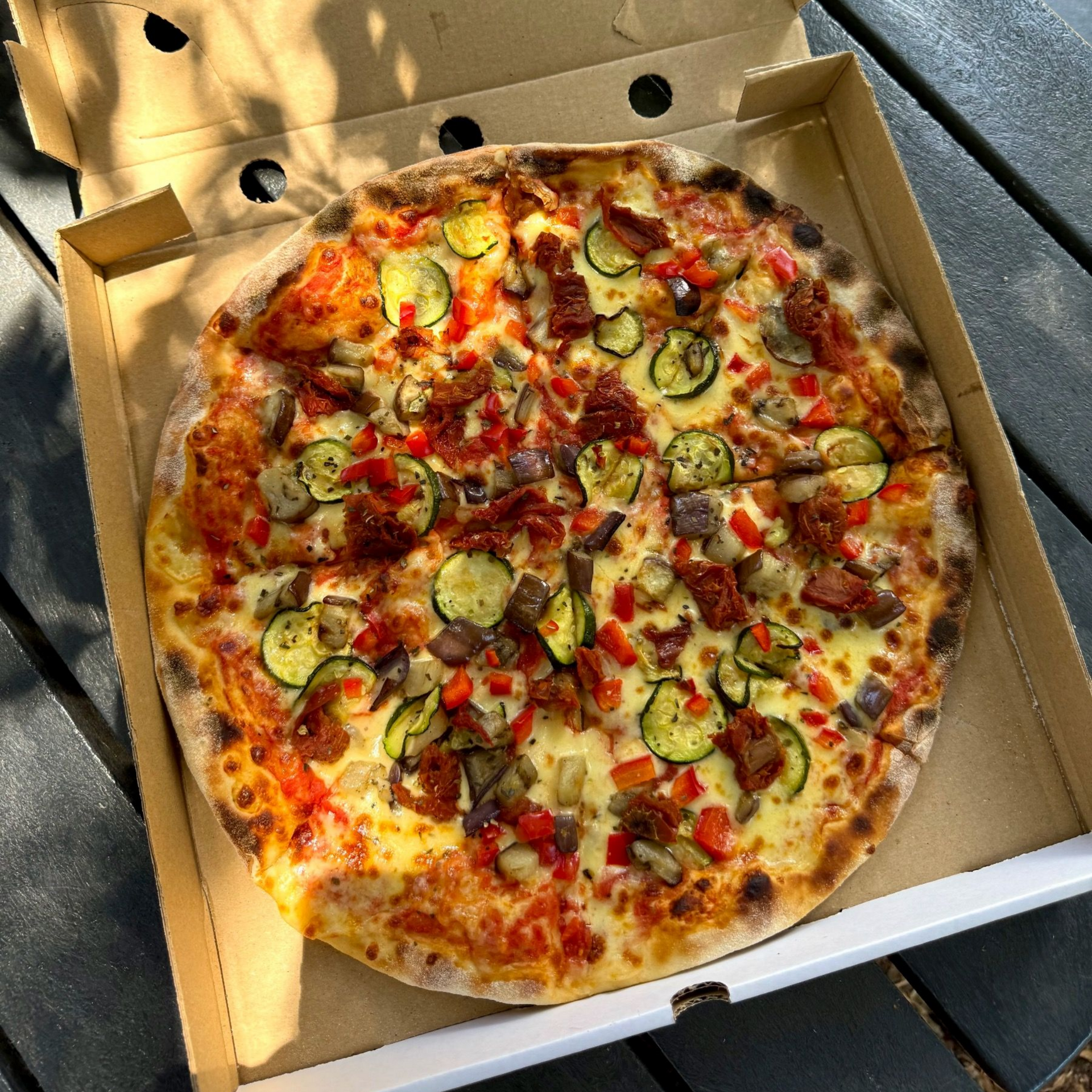 Full Contadina pizza with sun dried tomato, zucchini, peppers, eggplant from Piccolo Posticino Rondebosch