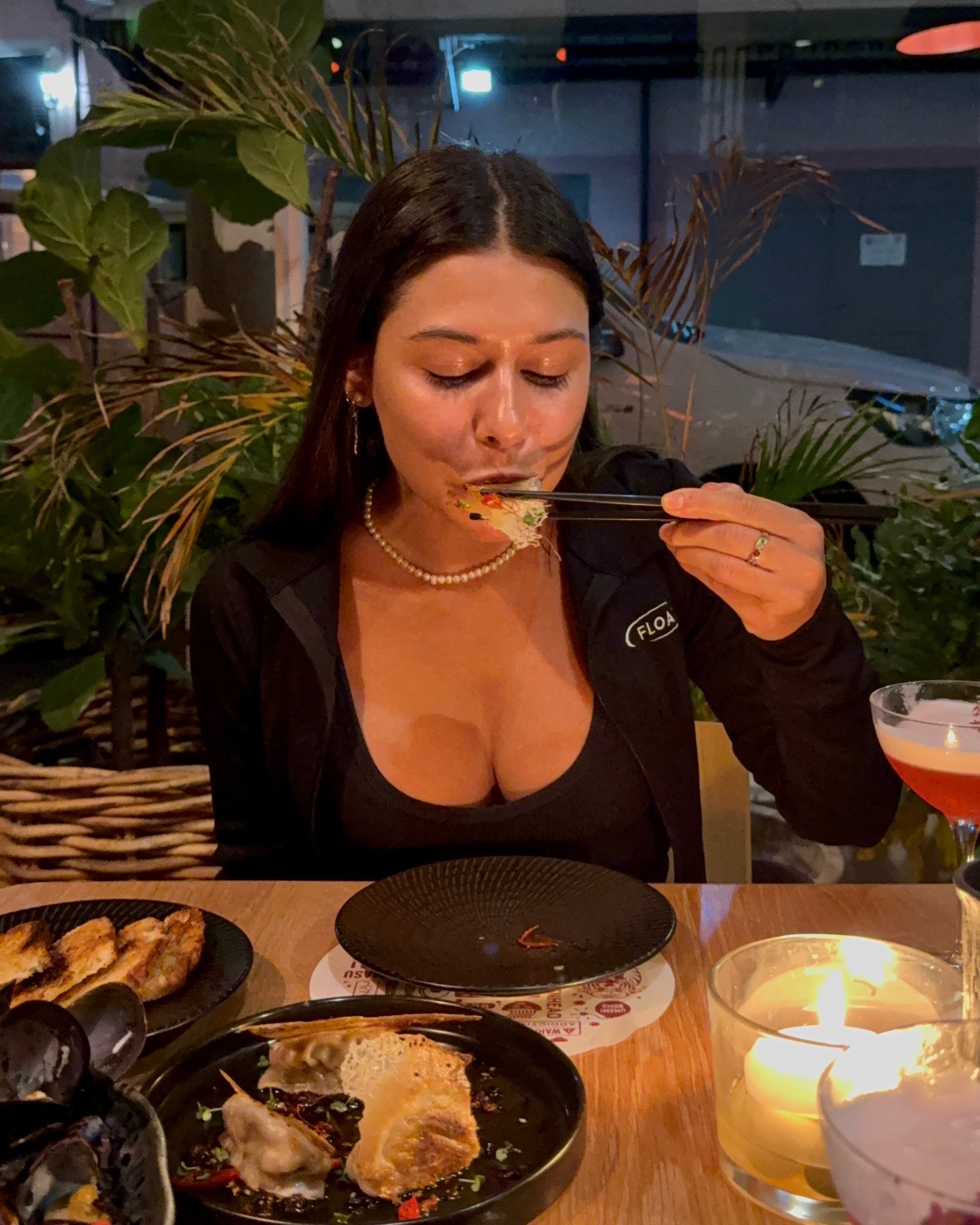 Paige is eating a dumpling at Ramenhead Cape Town