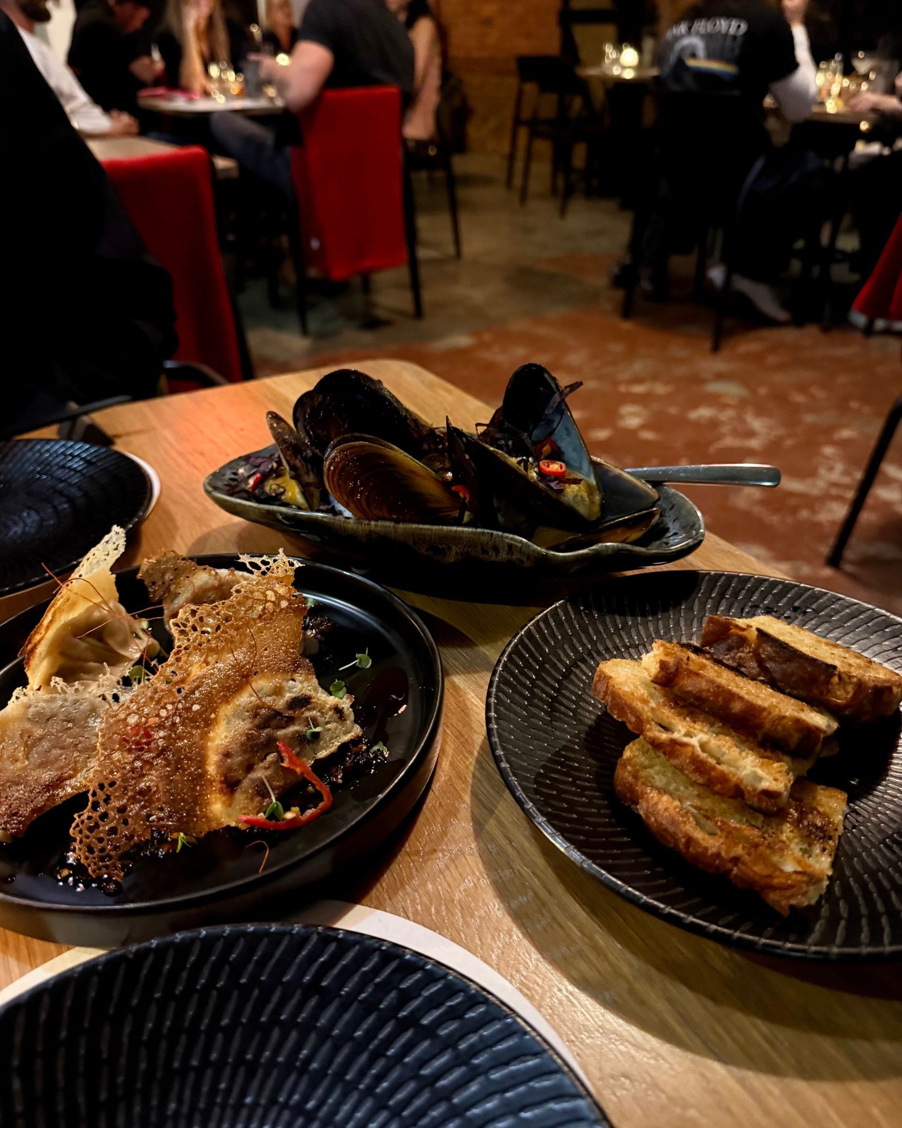 Aubergine and sweet corn gyoza with sake steamed mussels at Ramenhead