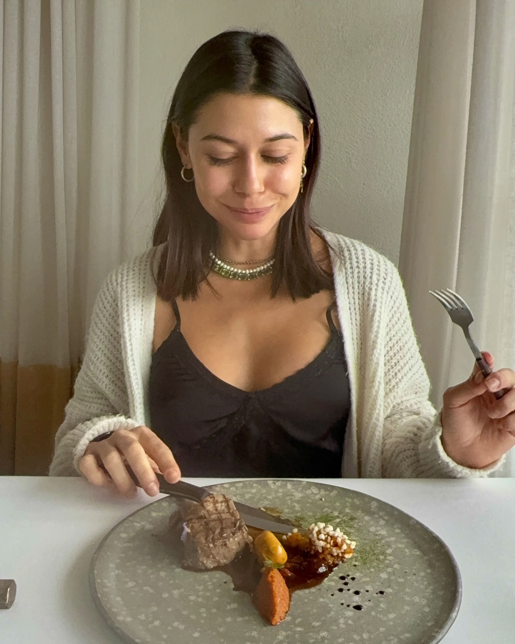 Paige enjoying beef fillet course at Salsify The Roundhouse