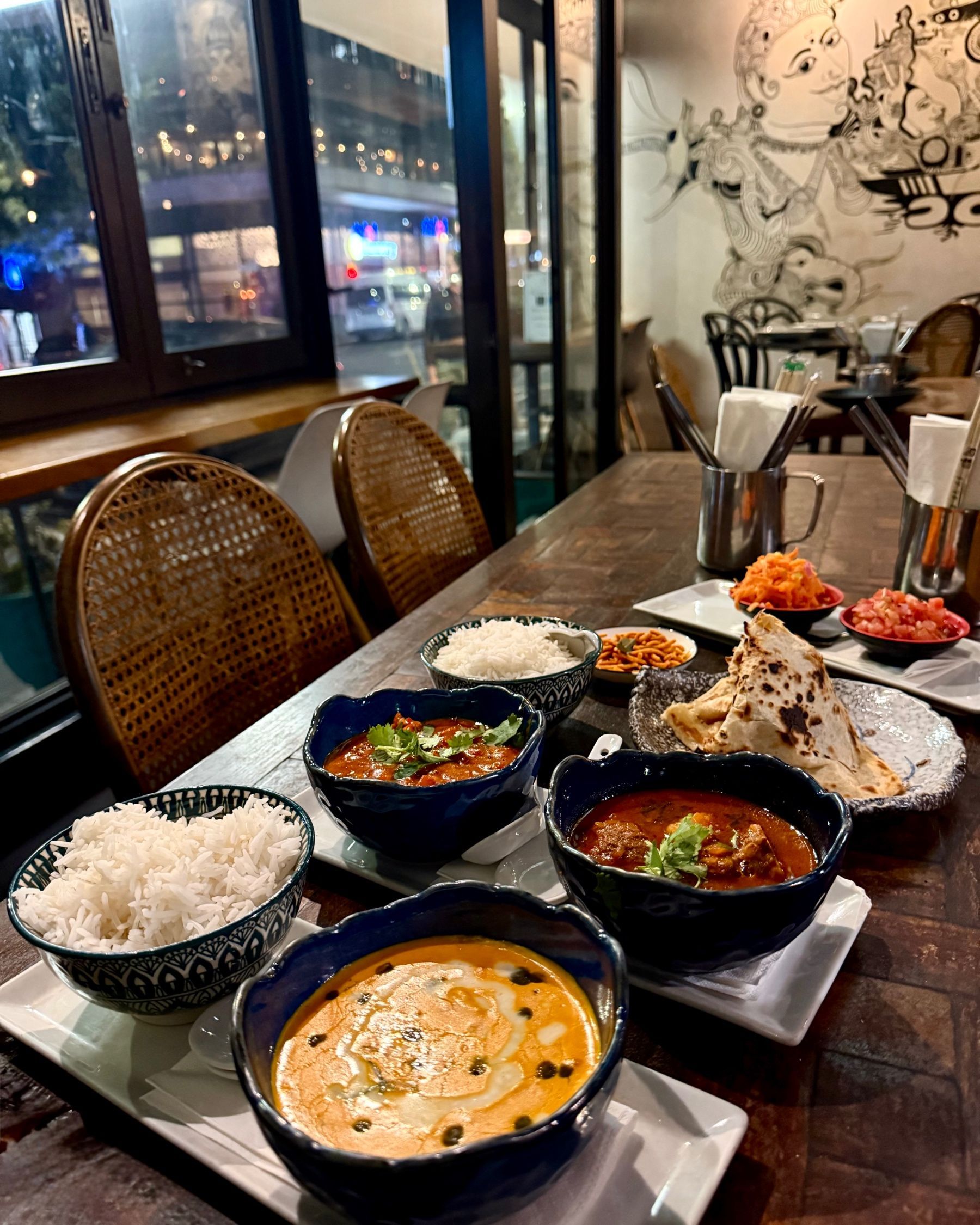 Curries with paratha, sambal, and rice at Sundoo Sea Point
