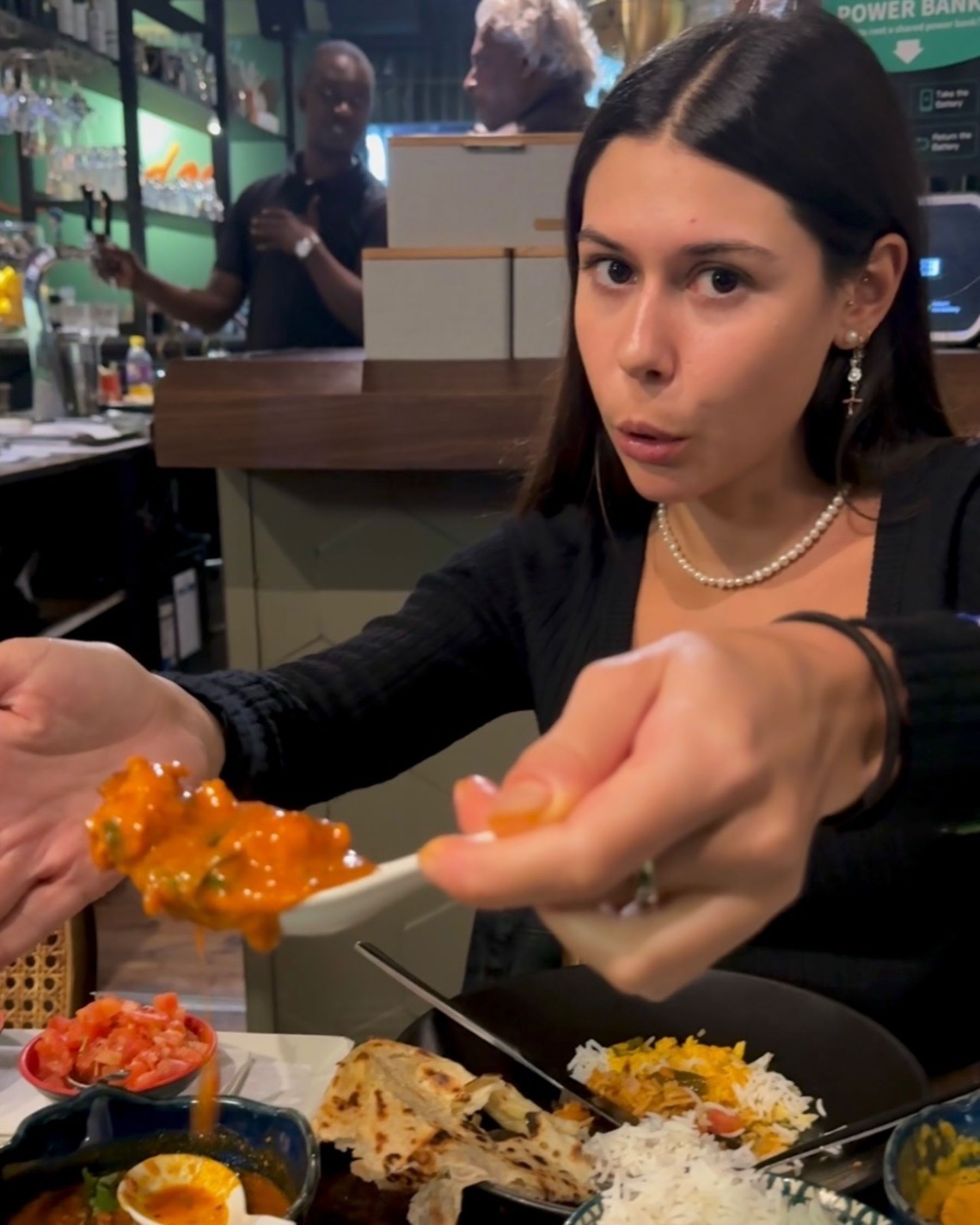 Paige is eating crayfish curry at Sundoo Sea Point
