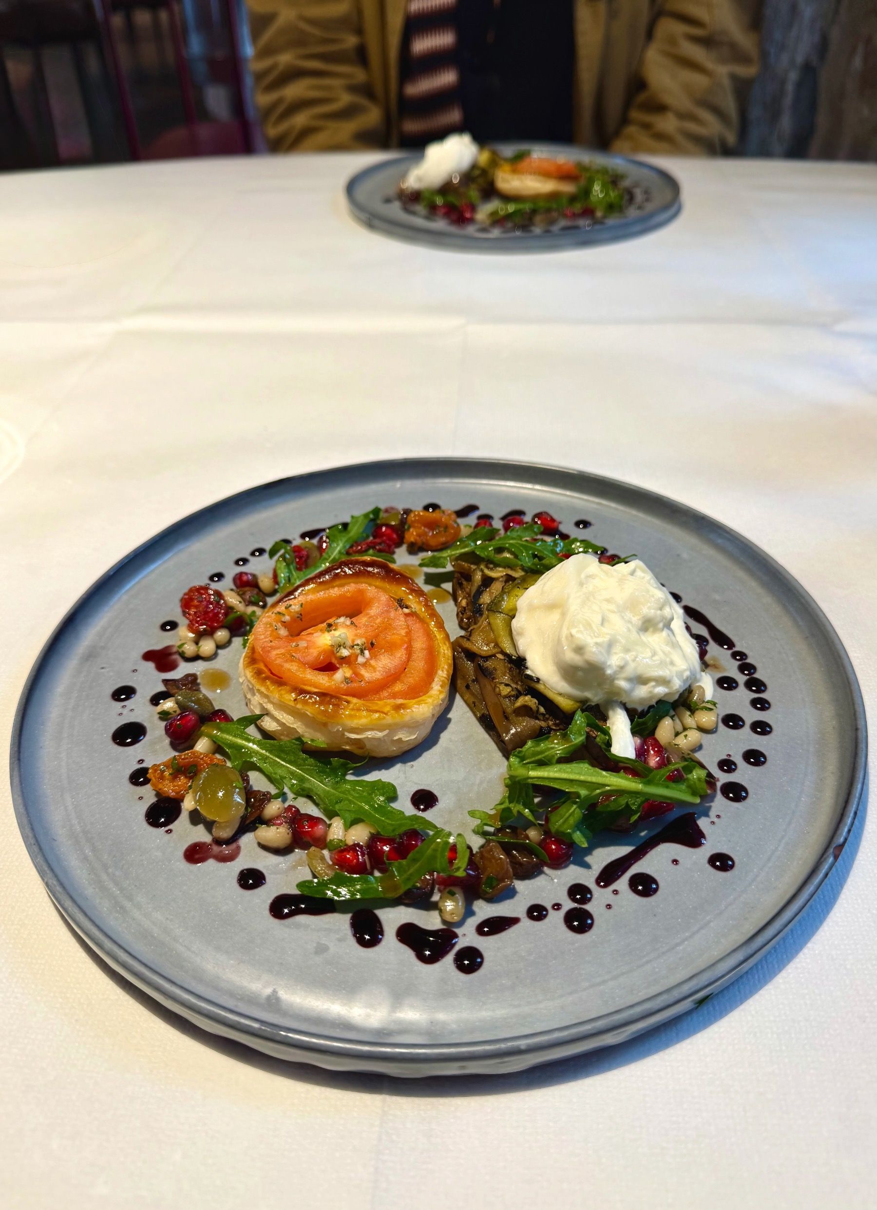 Heirloom tomato tart with burrata and basil at The Test Kitchen