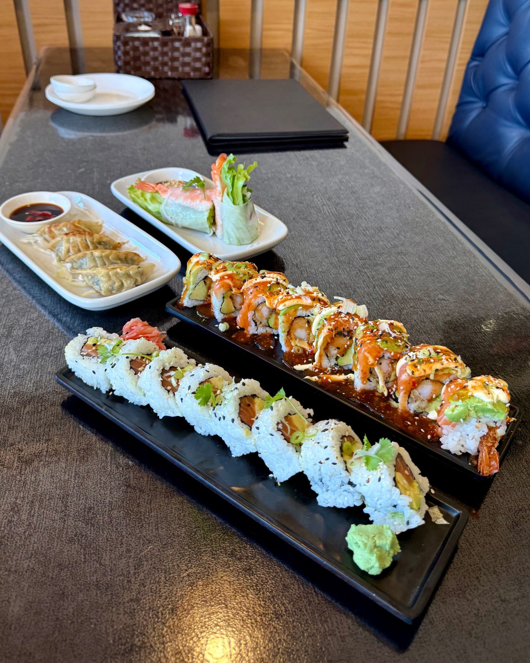 Starters at Vietnamese Street Kitchen including sushi, pork wontons and fresh prawn spring rolls
