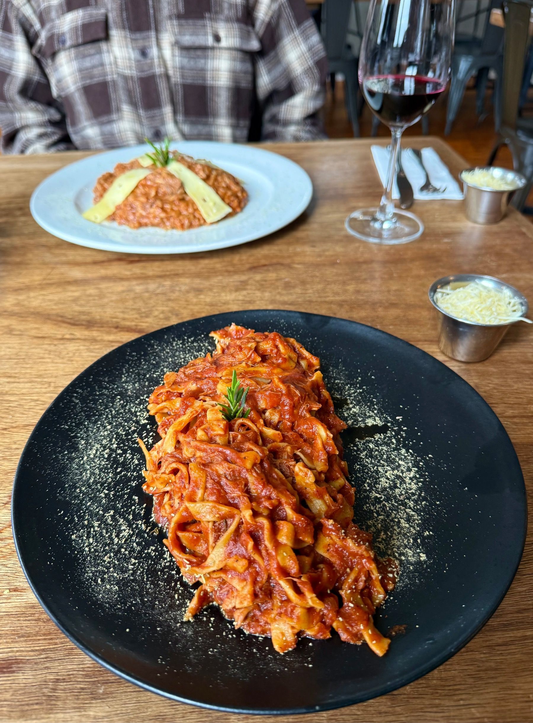 Freshly plated pasta main course at Woodlands Eatery, Cape Town, topped with herbs and grated cheese