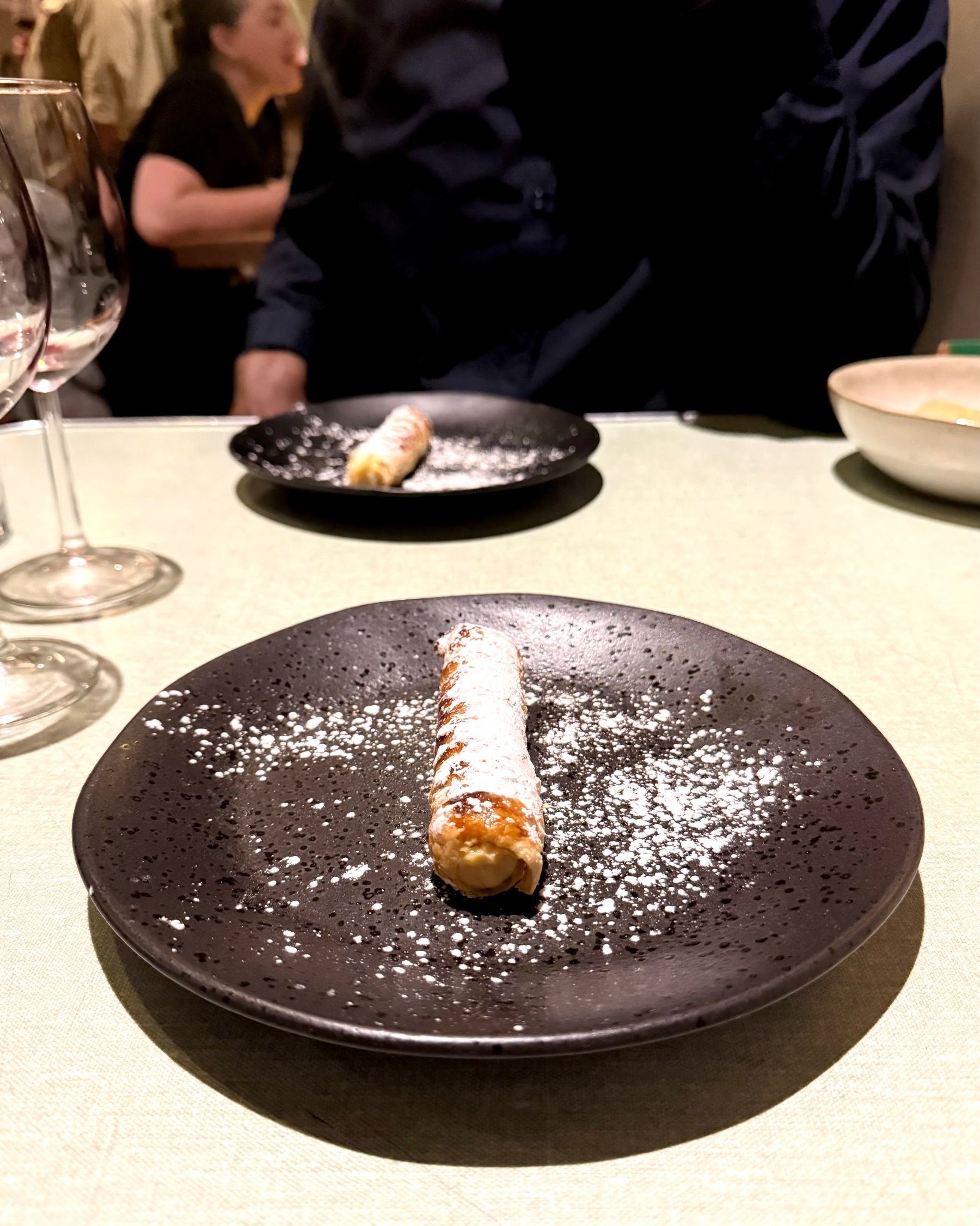 Classic Italian cannoli dessert plated at The Woodlands Eatery wine pairing evening.