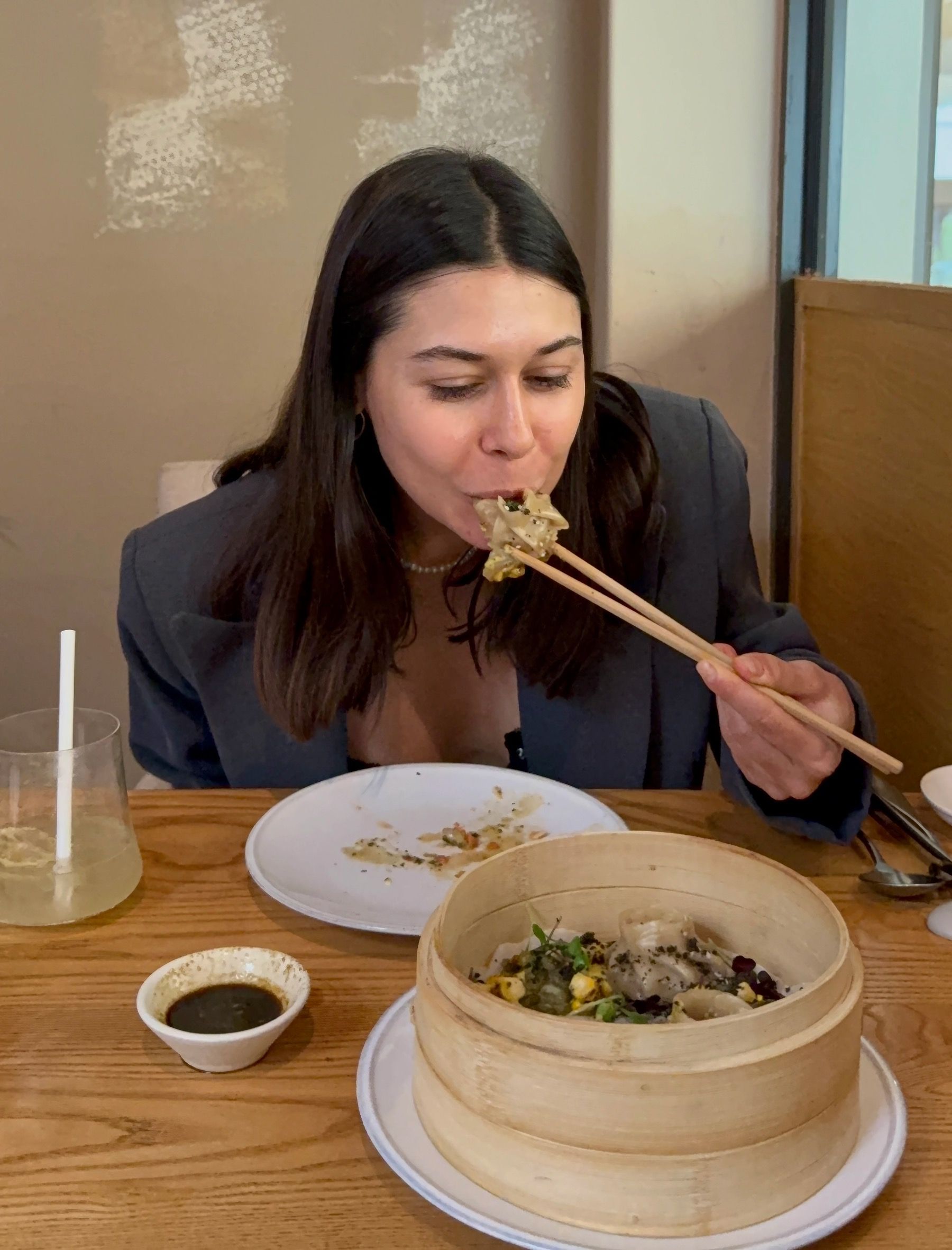 Paige eating steamed dumpling at Yama Asian restaurant Cape Town