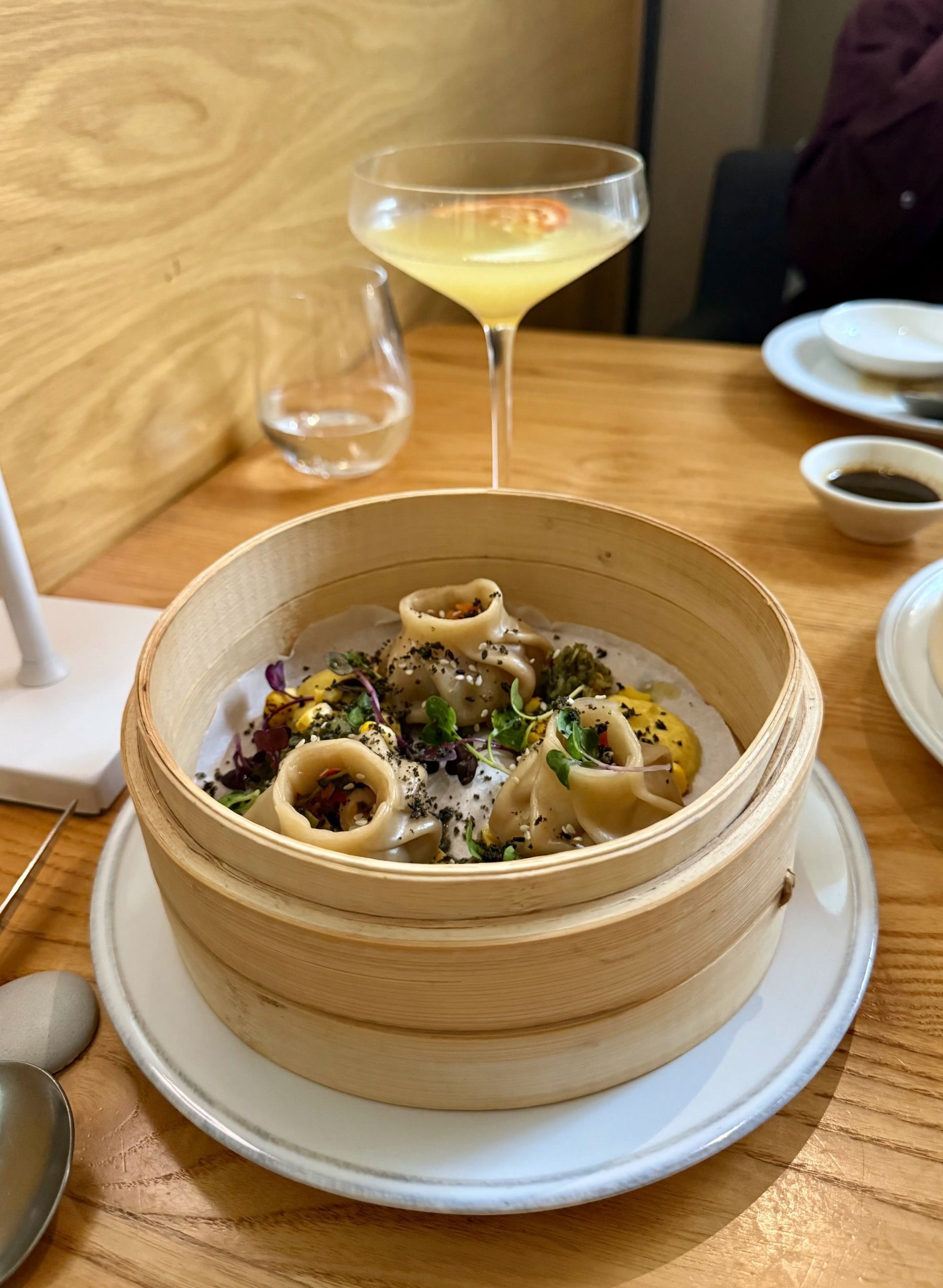 Steamed dumplings in bamboo basket at Yama Asian restaurant Cape Town