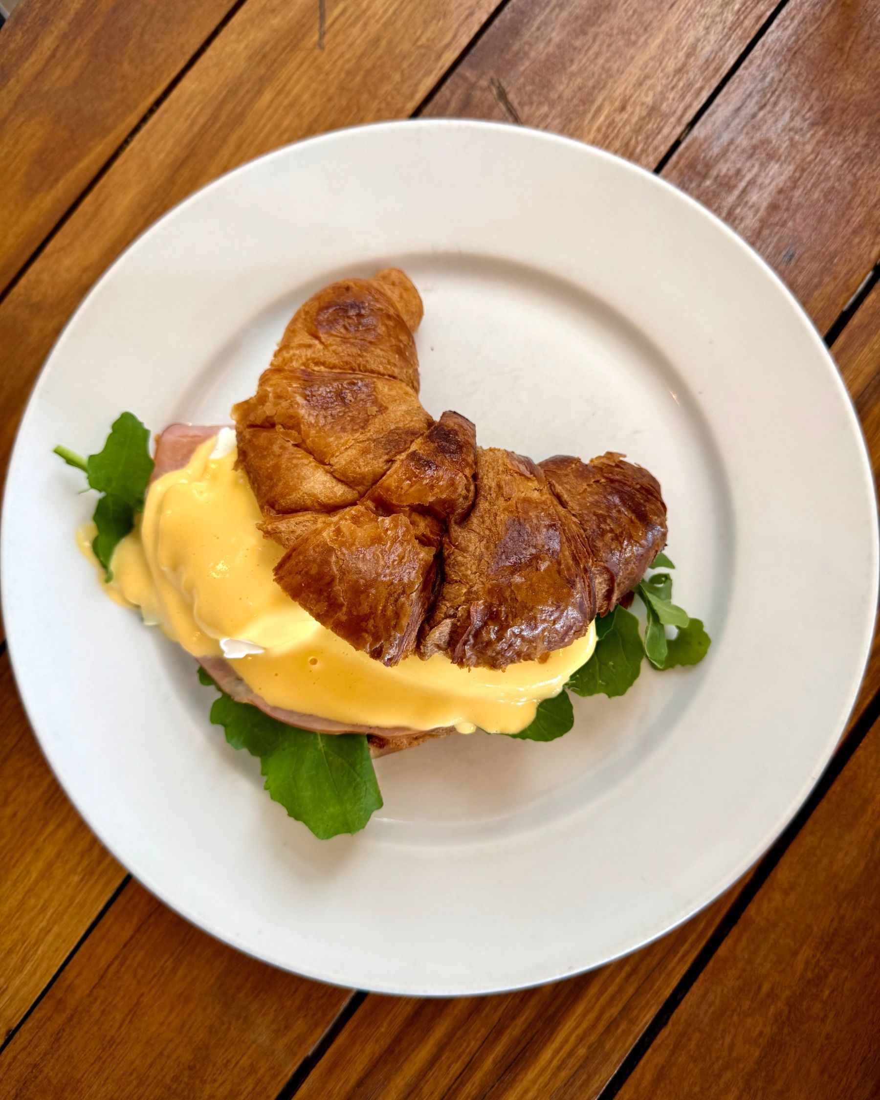 Croissant Eggs Benedict in the foreground at Dalebrook Cafe