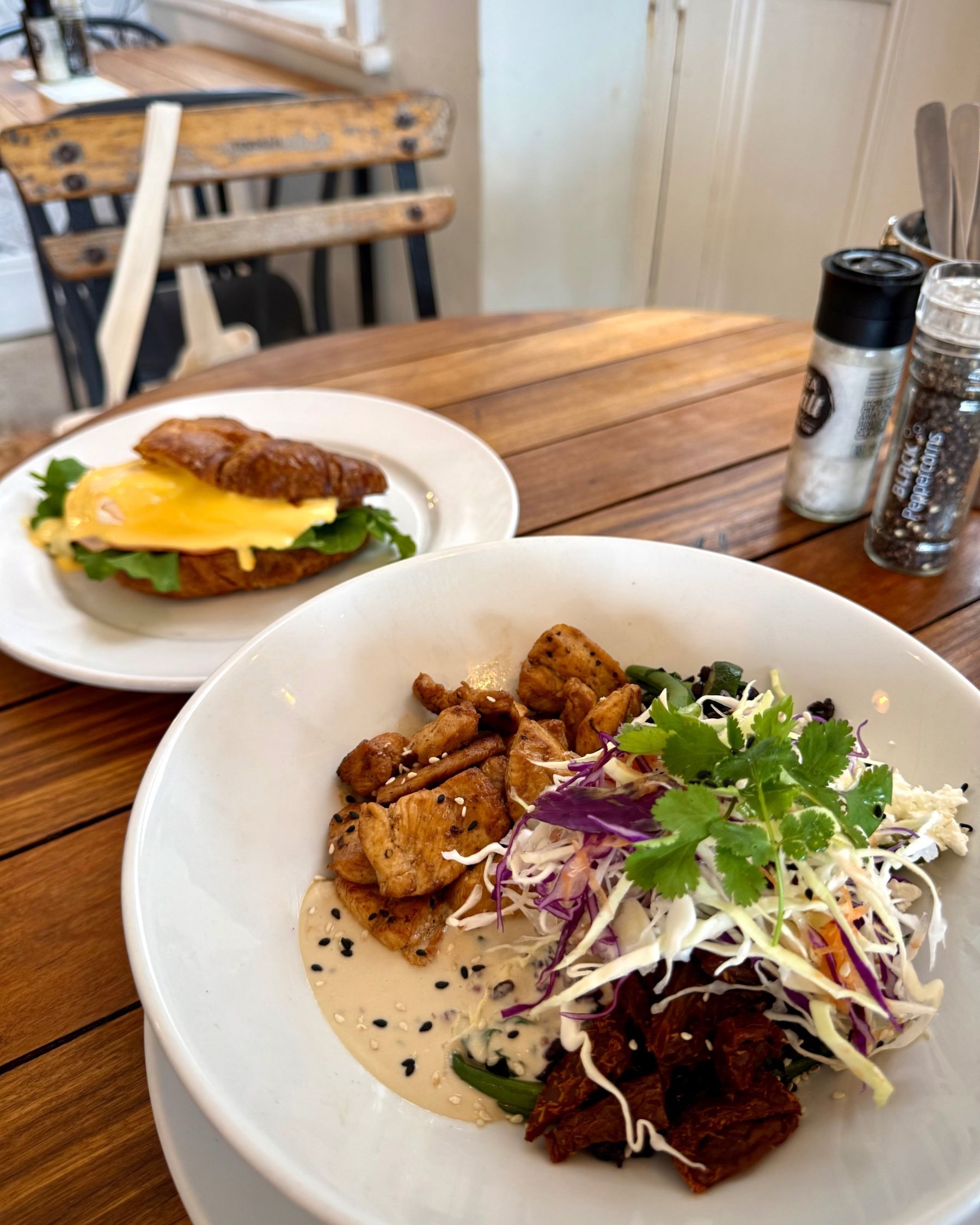 Croissant Eggs Benedict and Chicken Bowl served together at Dalebrook Café.