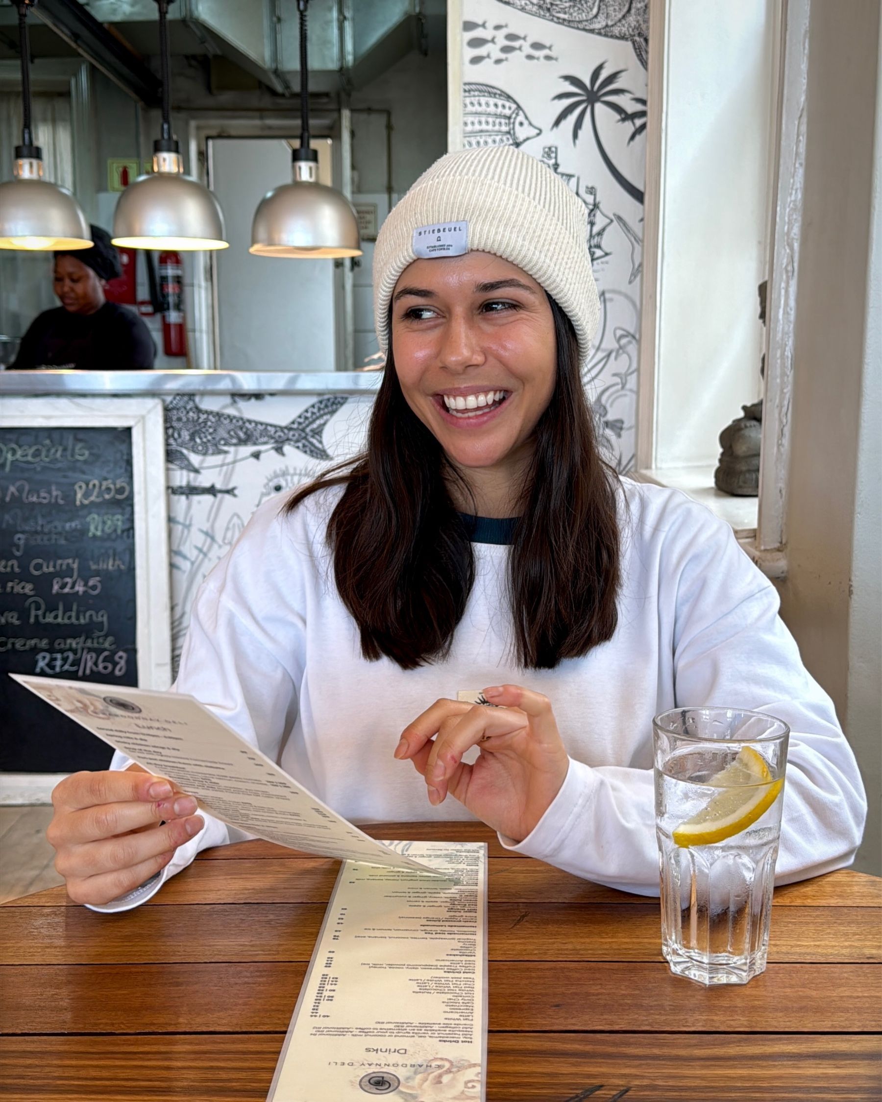 Paige reading the Dalebrook Café menu before ordering.