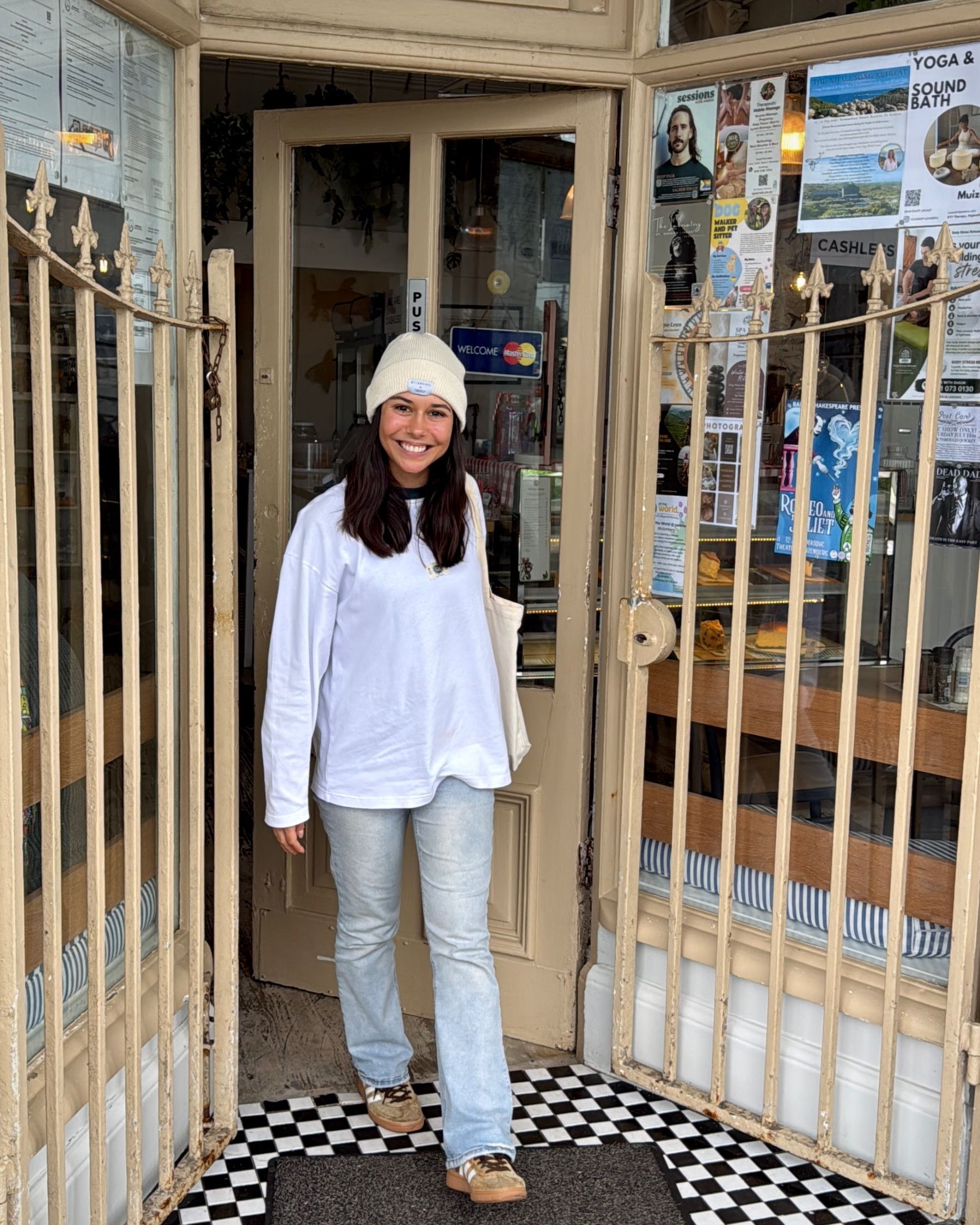 Paige leaving Dalebrook Café after breakfast in Kalk Bay.