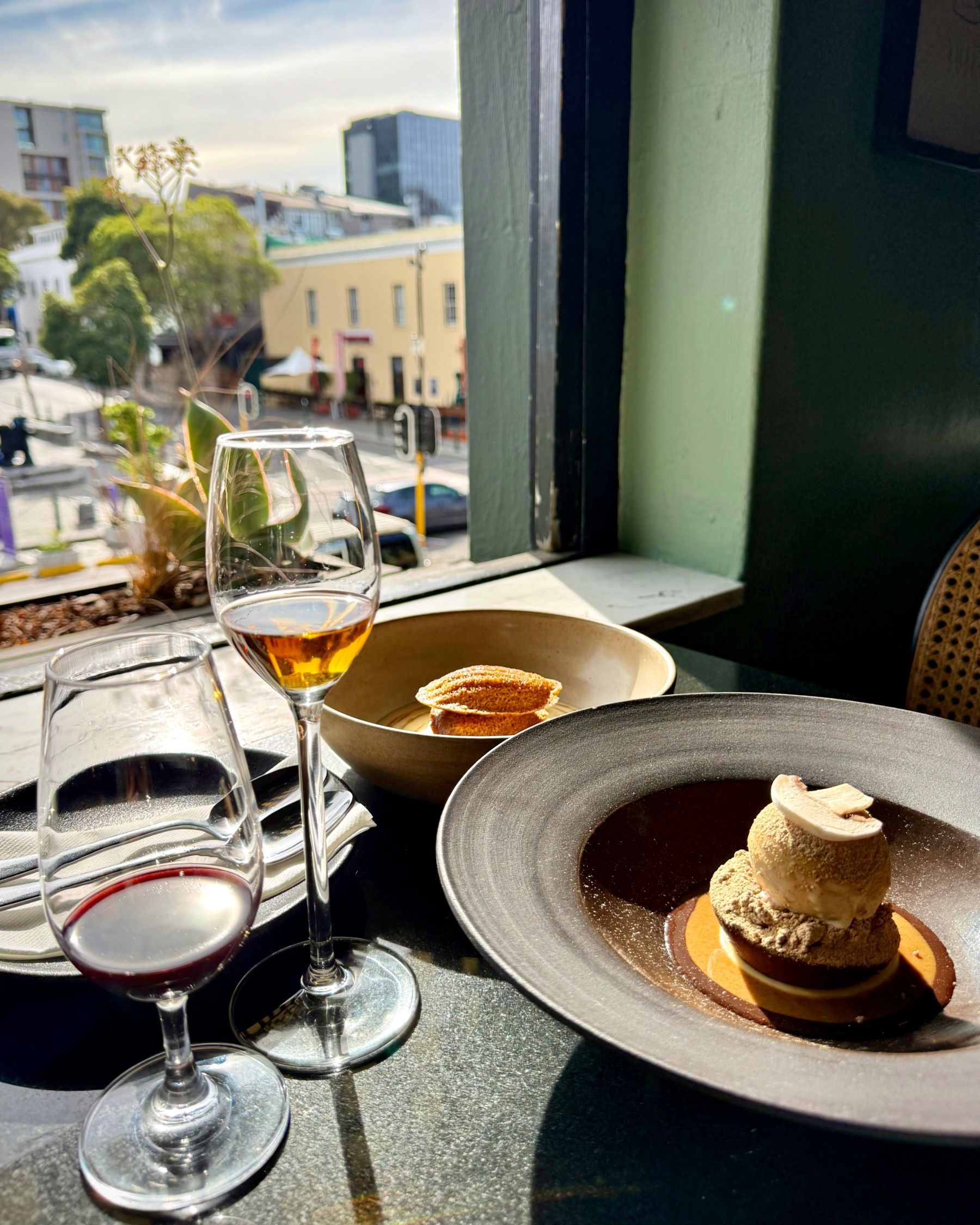 Malva pudding madeleines and chocolate fondant served for dessert.