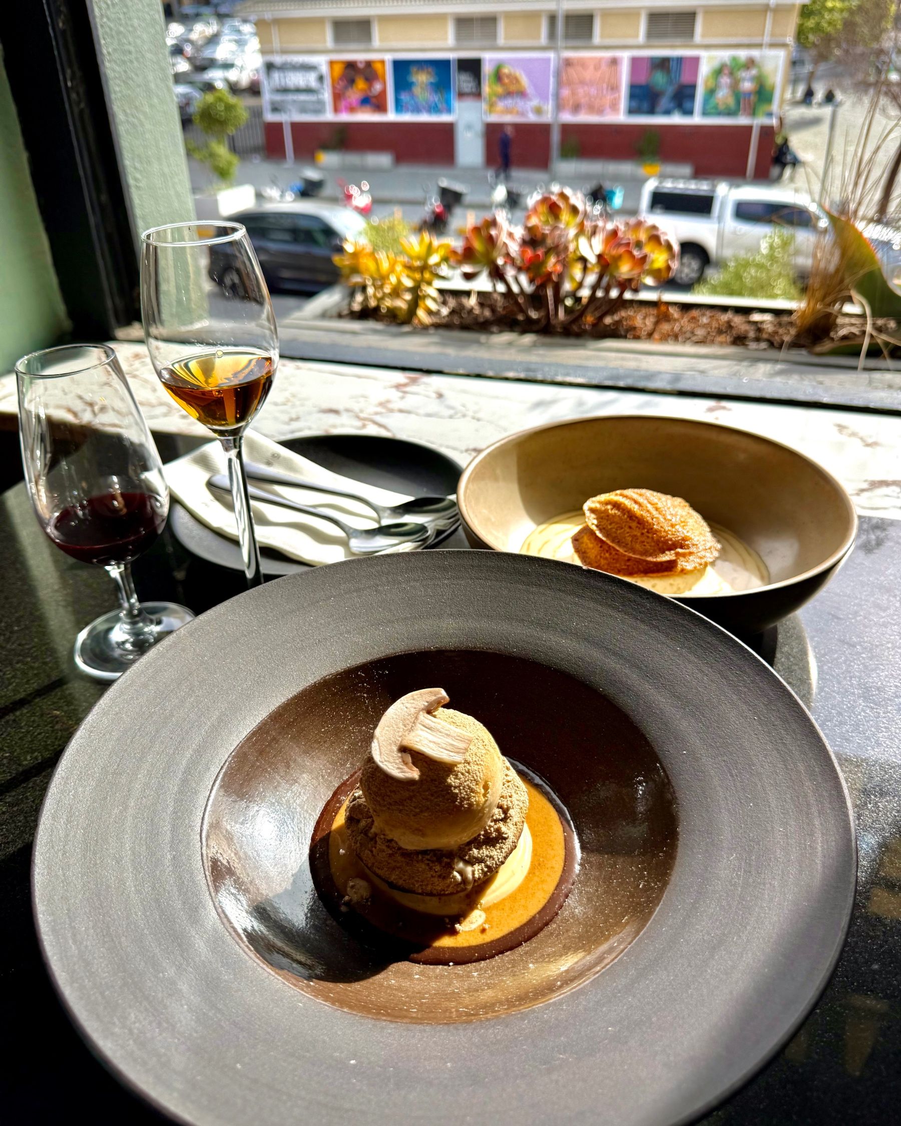 Malva pudding madeleines and chocolate fondant served for dessert.