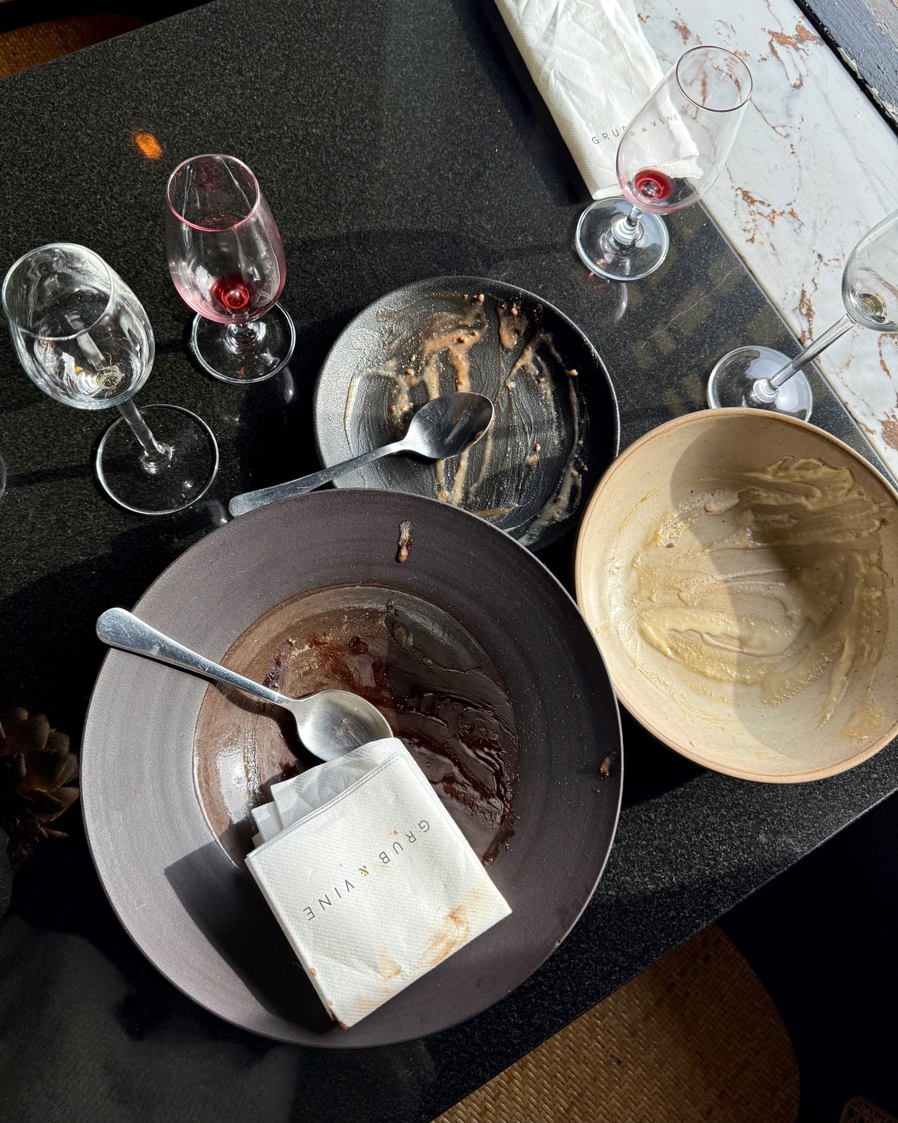 Empty dessert plates after finishing the meal at Grub & Vine.