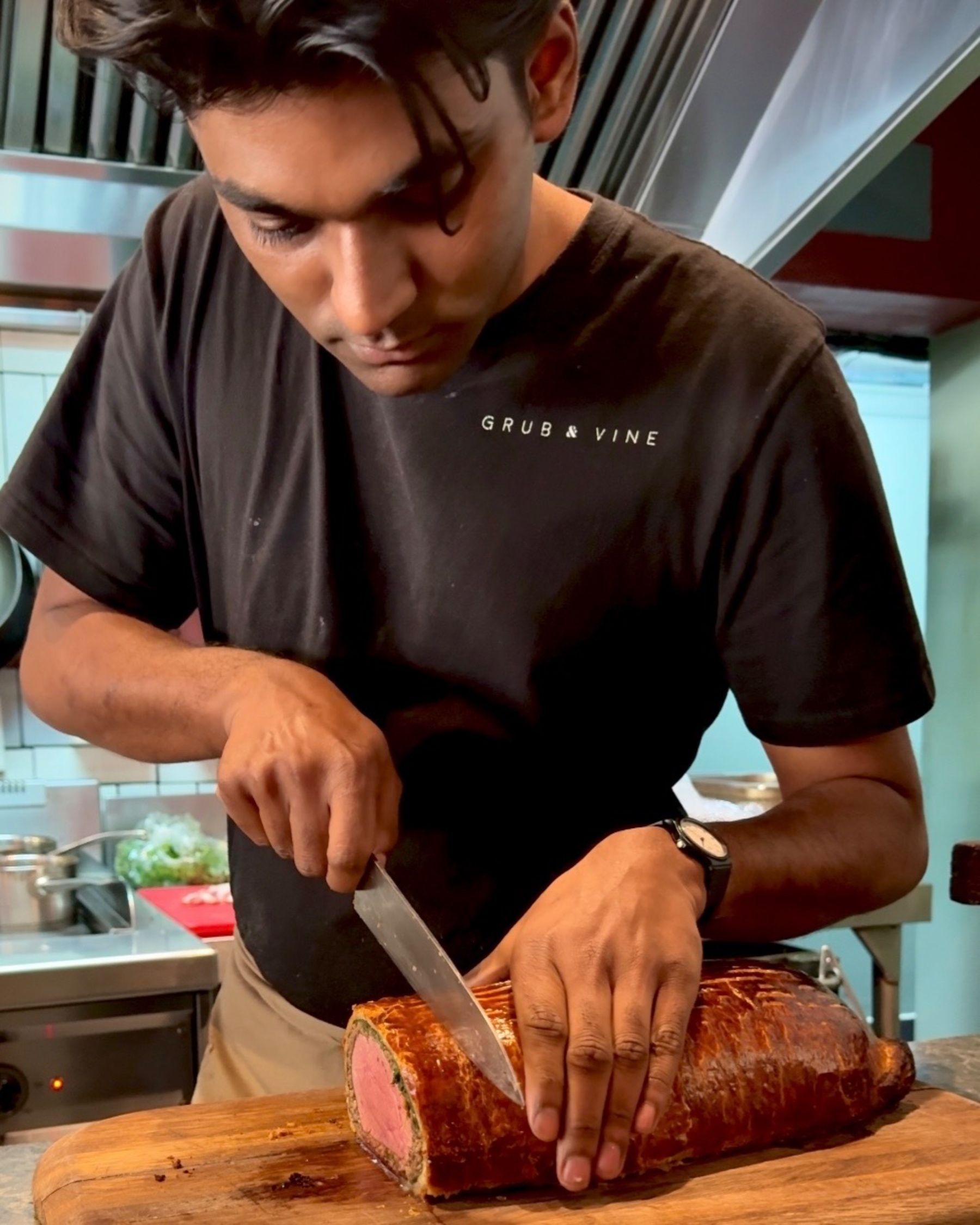 Chef slicing the Beef Wellington tableside.