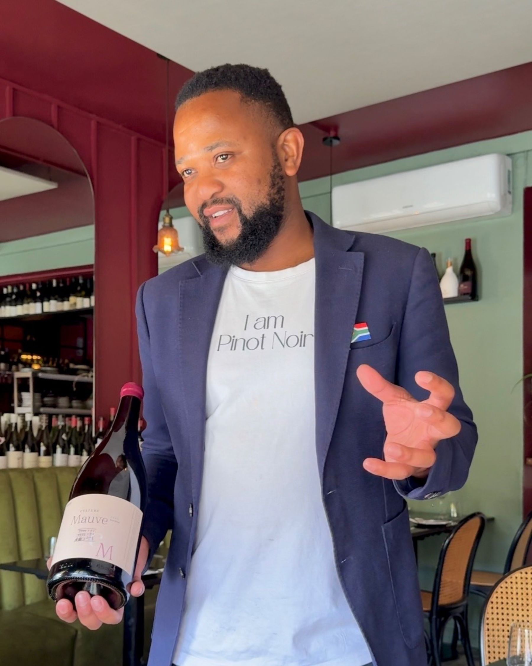 The Grub & Vine sommelier presenting a South African red wine.