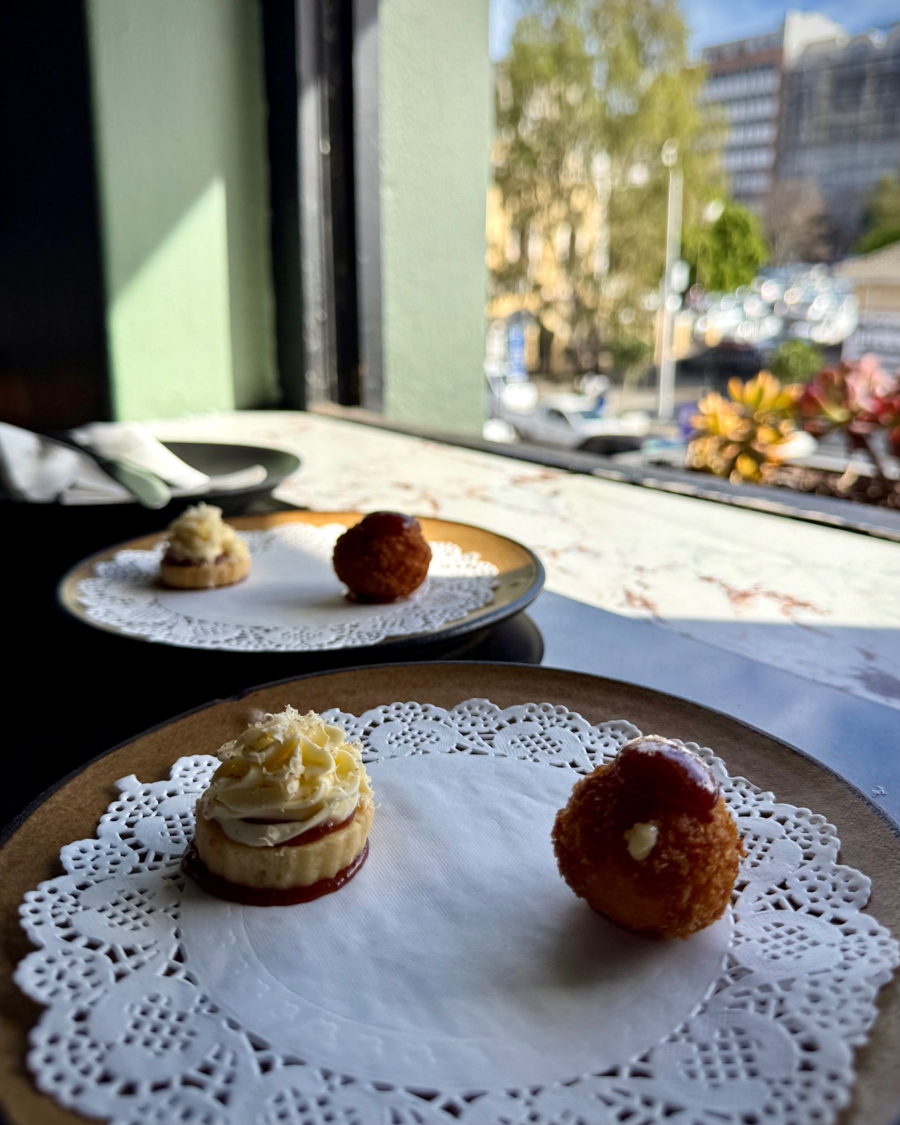 Beef Welly Fridays canapés featuring a bacon jam biscuit and gem squash arancini.