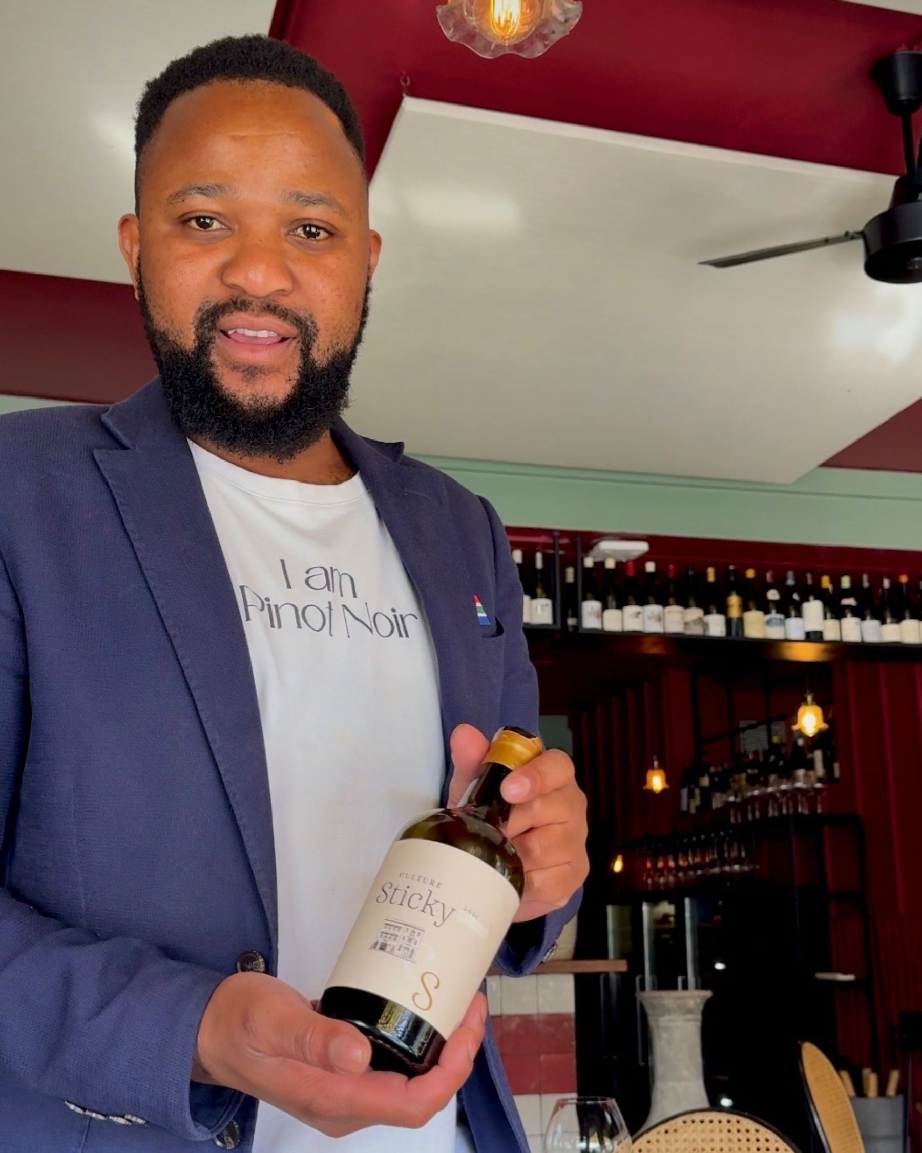 The Grub & Vine sommelier presenting the dessert wine.