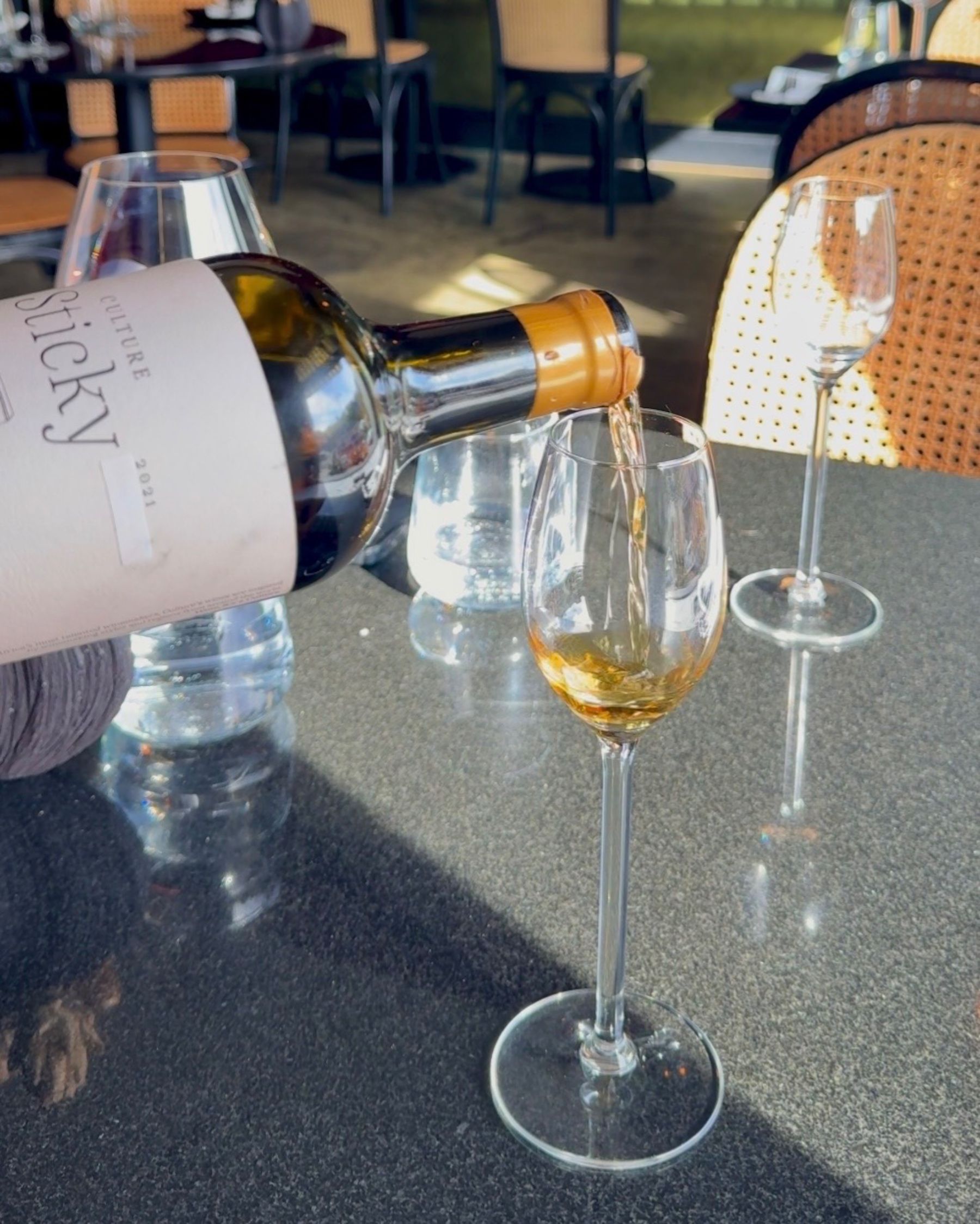 Dessert wine being poured at Grub & Vine.