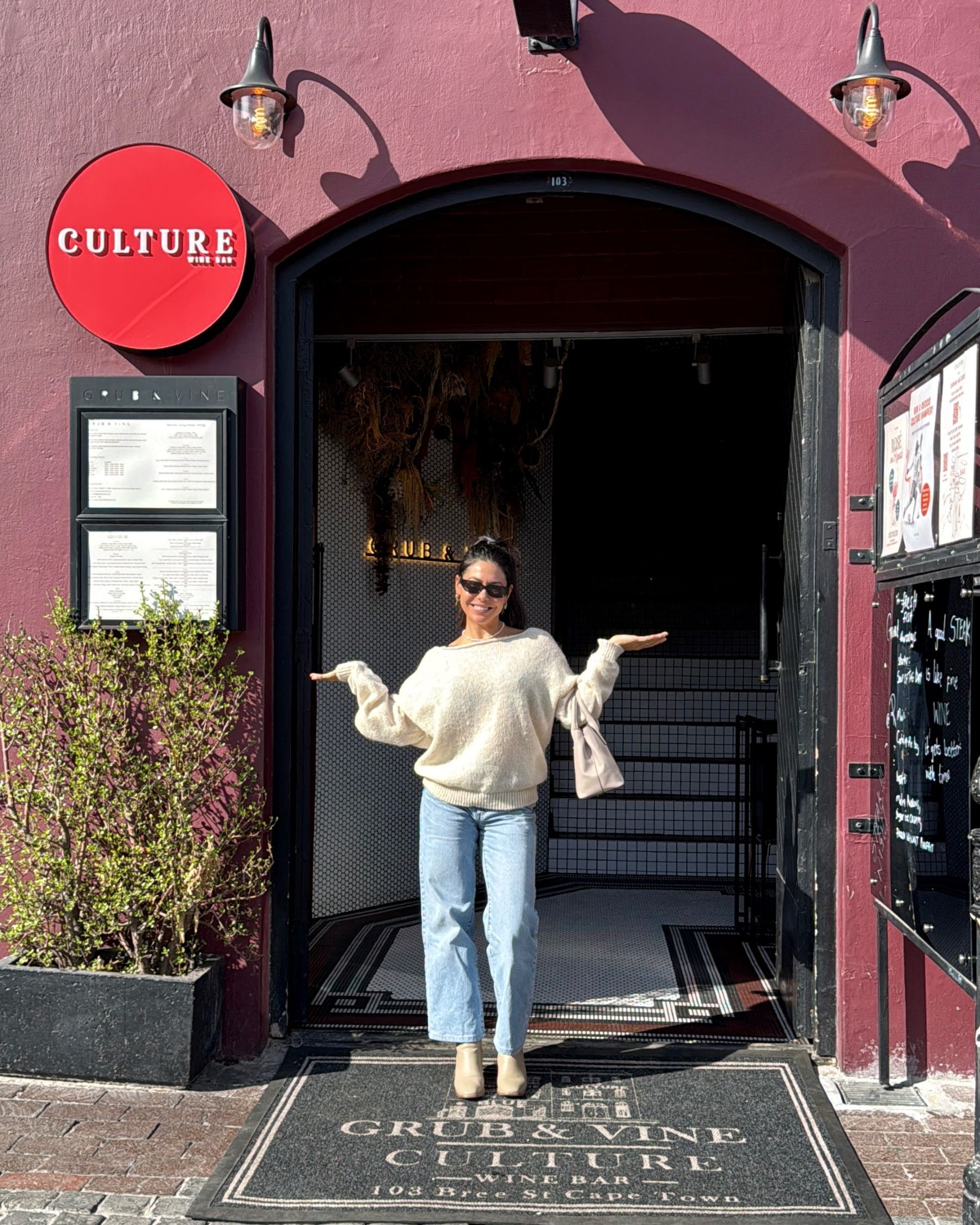 Paige standing outside Grub & Vine on Bree Street in Cape Town.