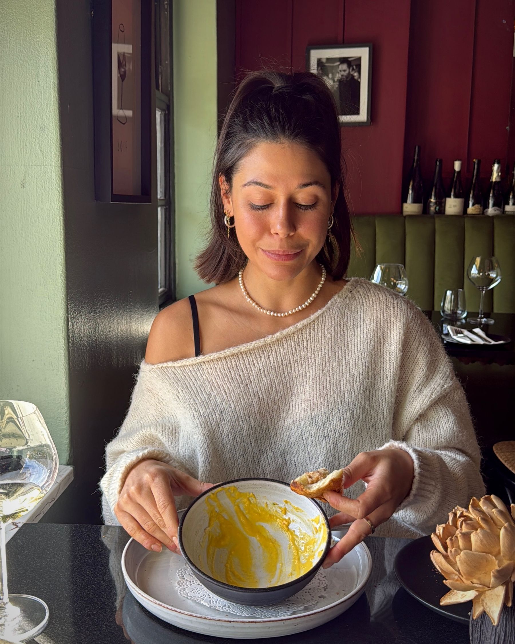 An empty soup bowl after finishing the carrot and Parmesan soup.