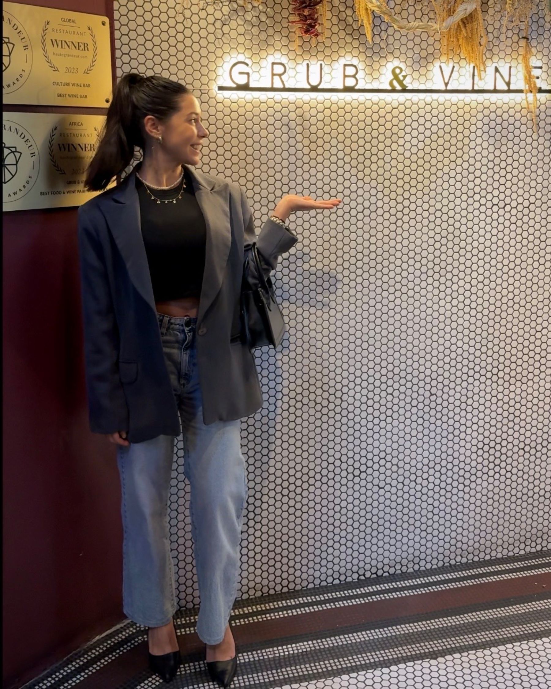 Paige standing outside Aiko Sushi Plus at Youngblood Gallery on Bree Street, Cape Town.