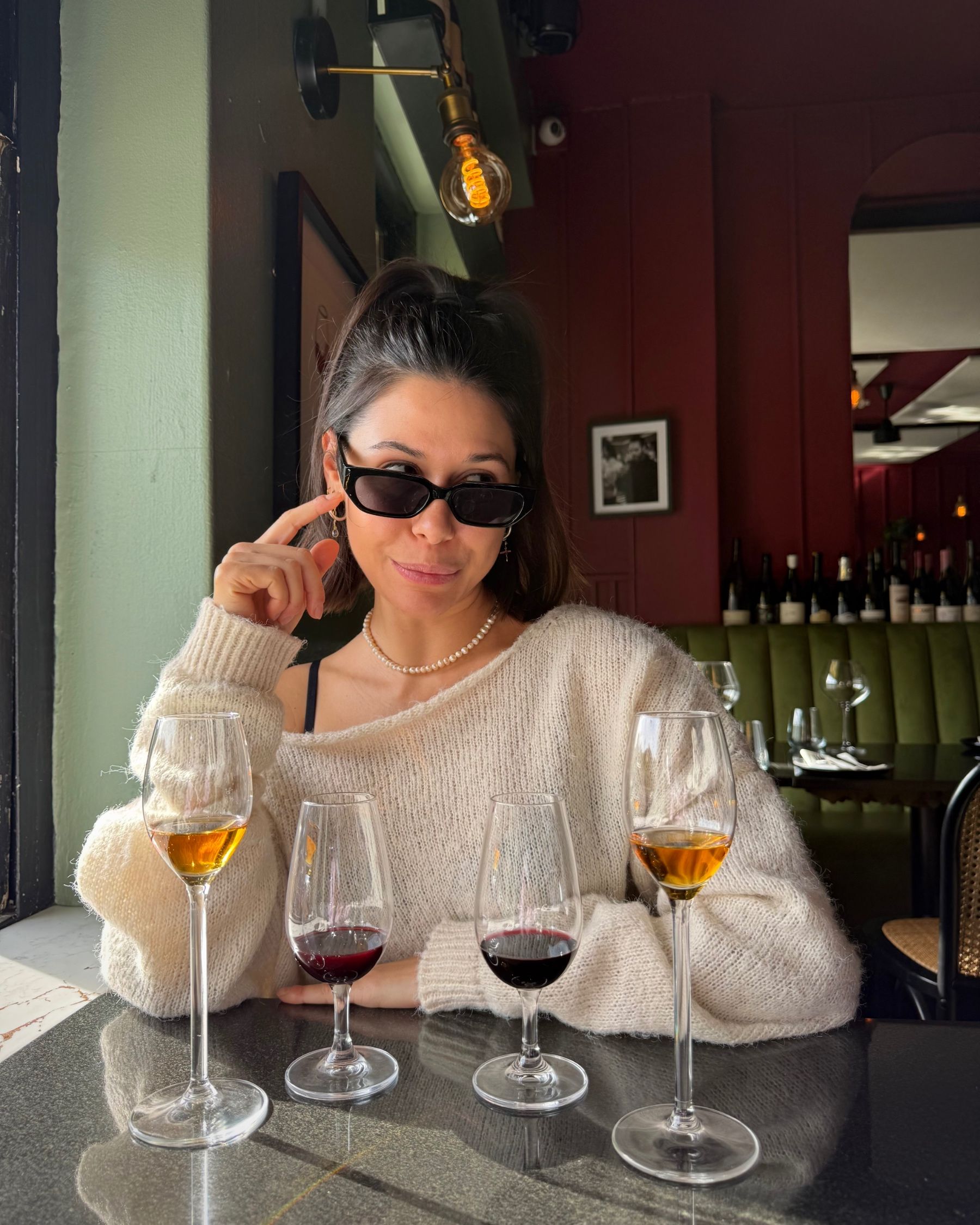 Paige wearing sunglasses with the dessert wines.