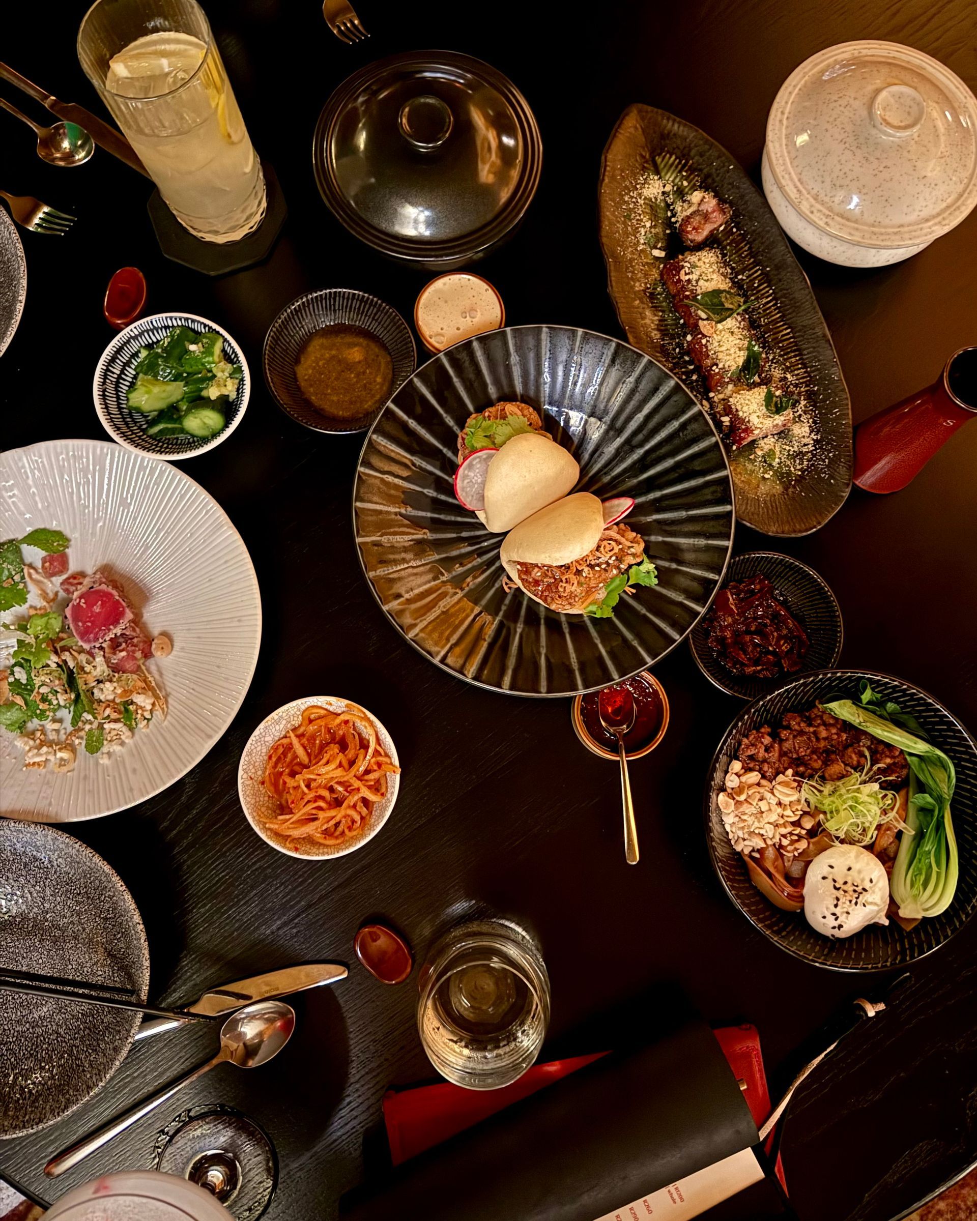 Tuna, Chicken Bao, Cashew Lamb Belly, Dry Pan Mee, Lamb Wontons, Beef Potstickers at The Red Room