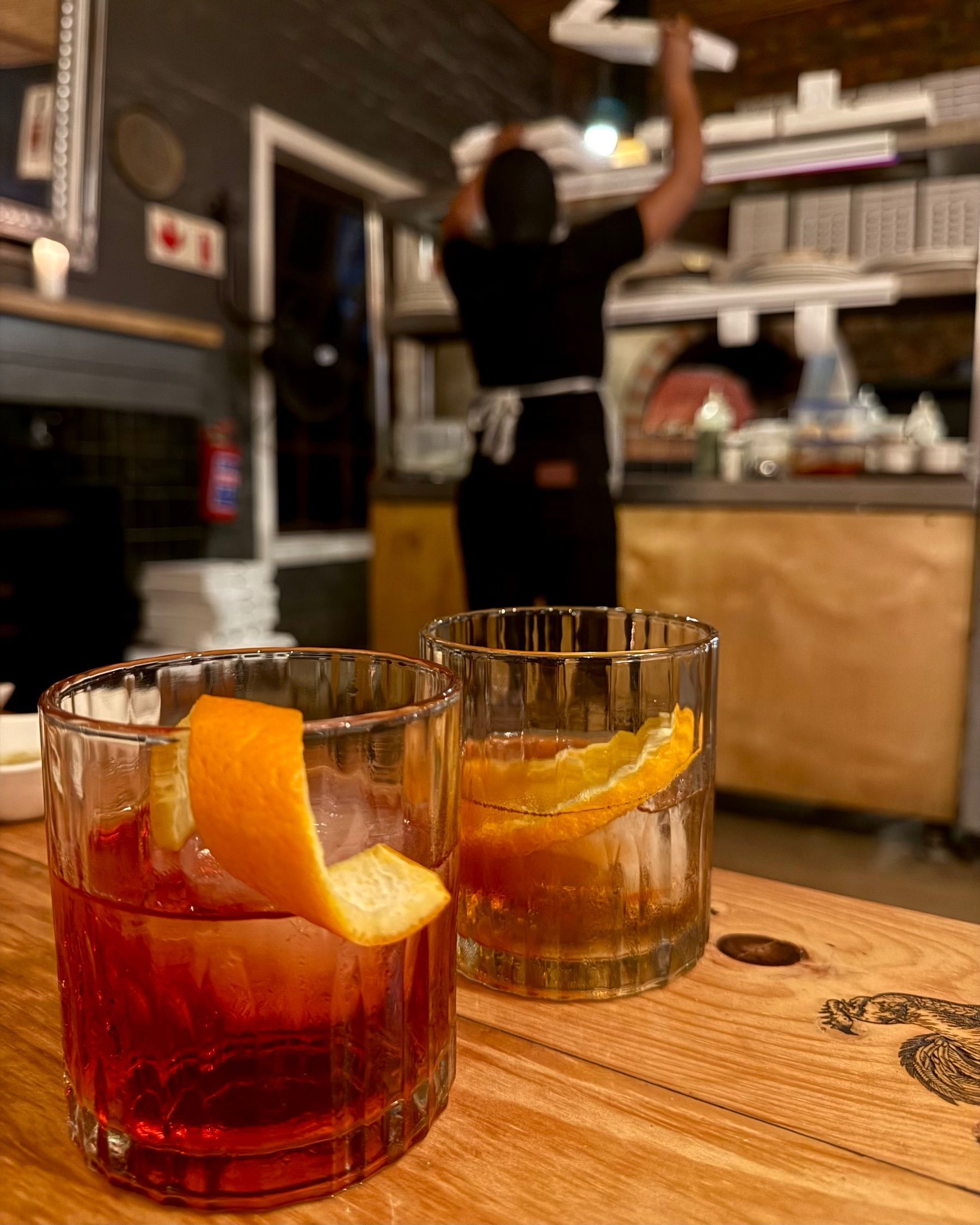 A Negroni and an Old Fashioned cocktail served at Massimo’s.