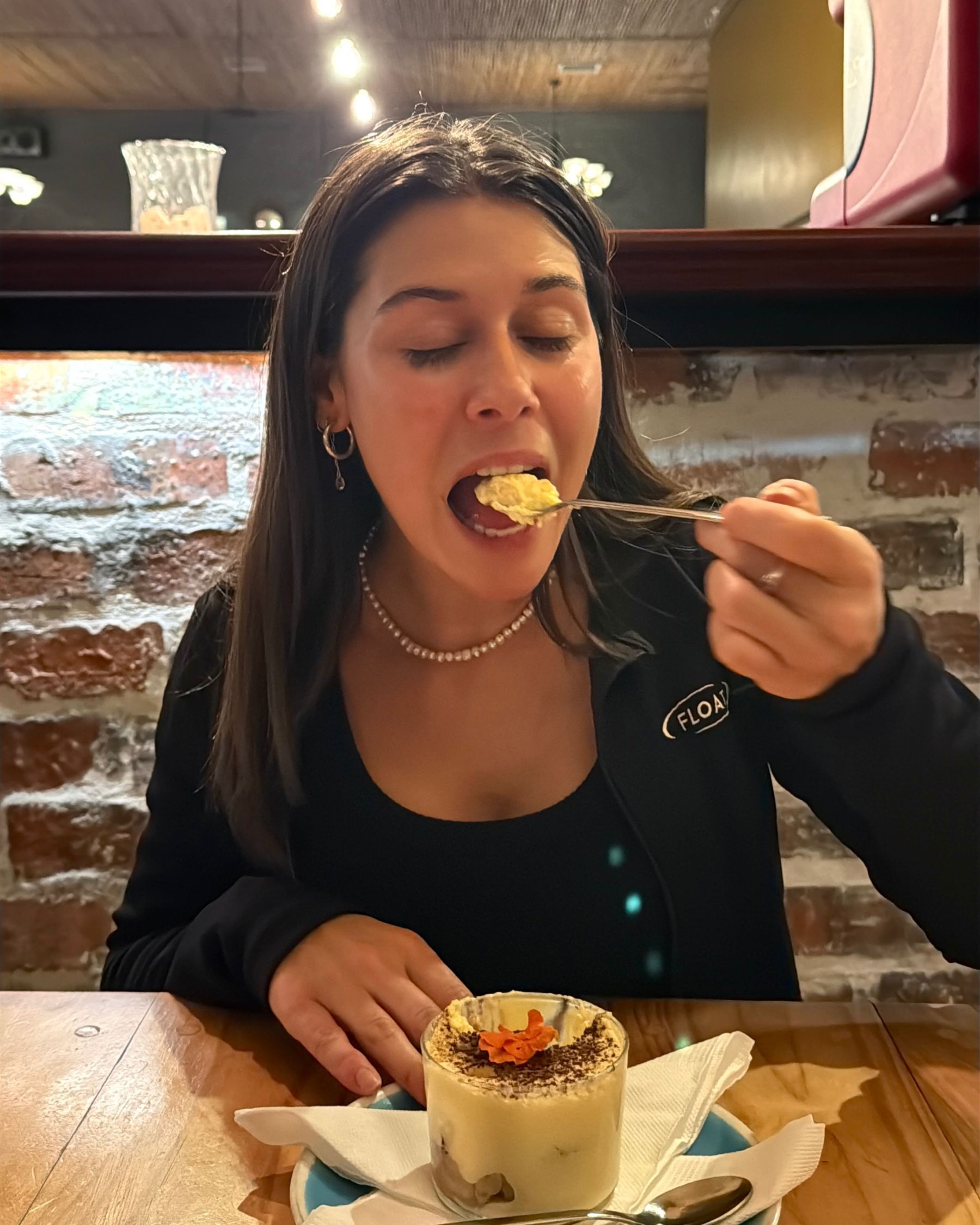 Paige enjoying a spoonful of tiramisu.
