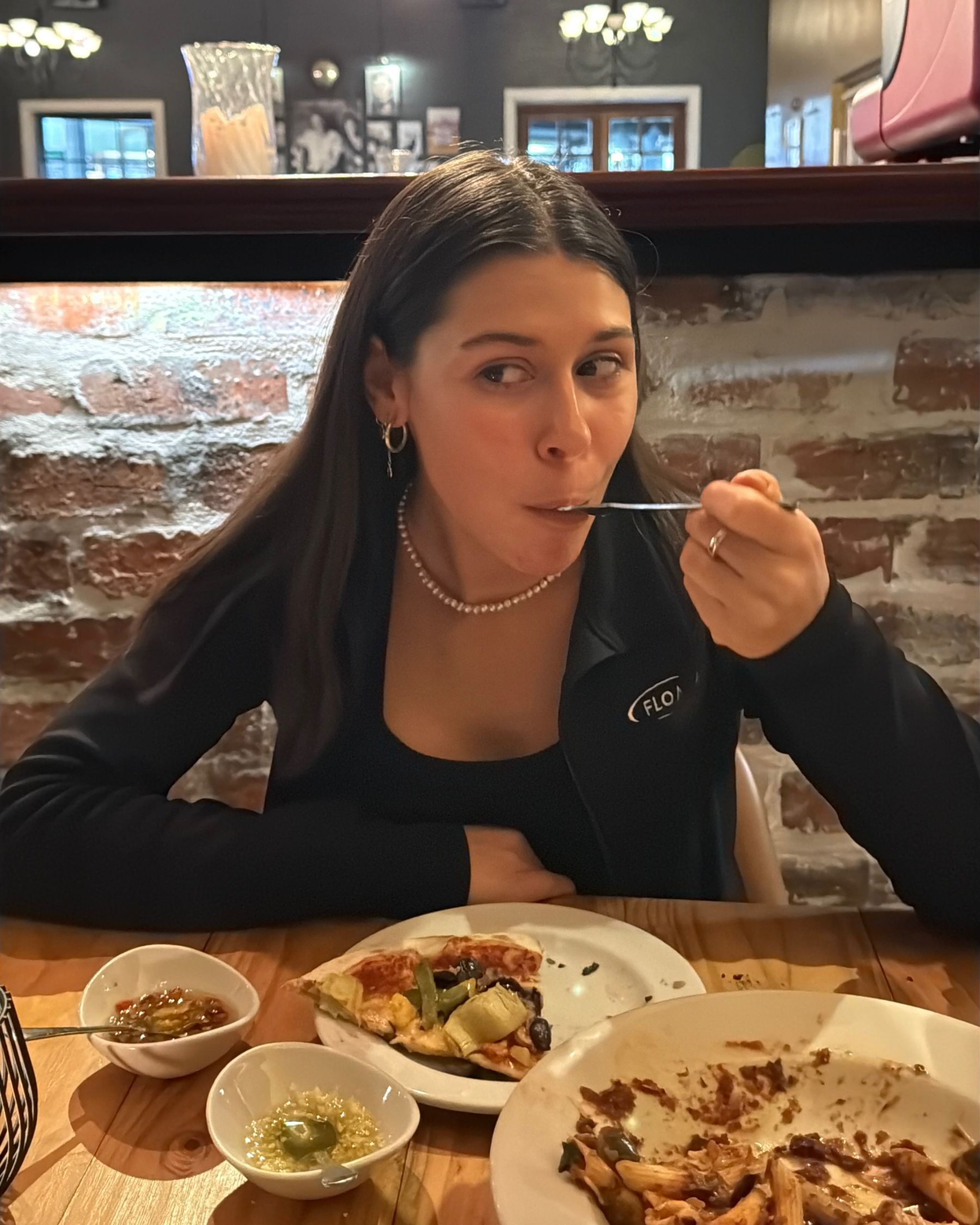 Paige enjoying the vegetarian pizza and penne puttanesca mains.
