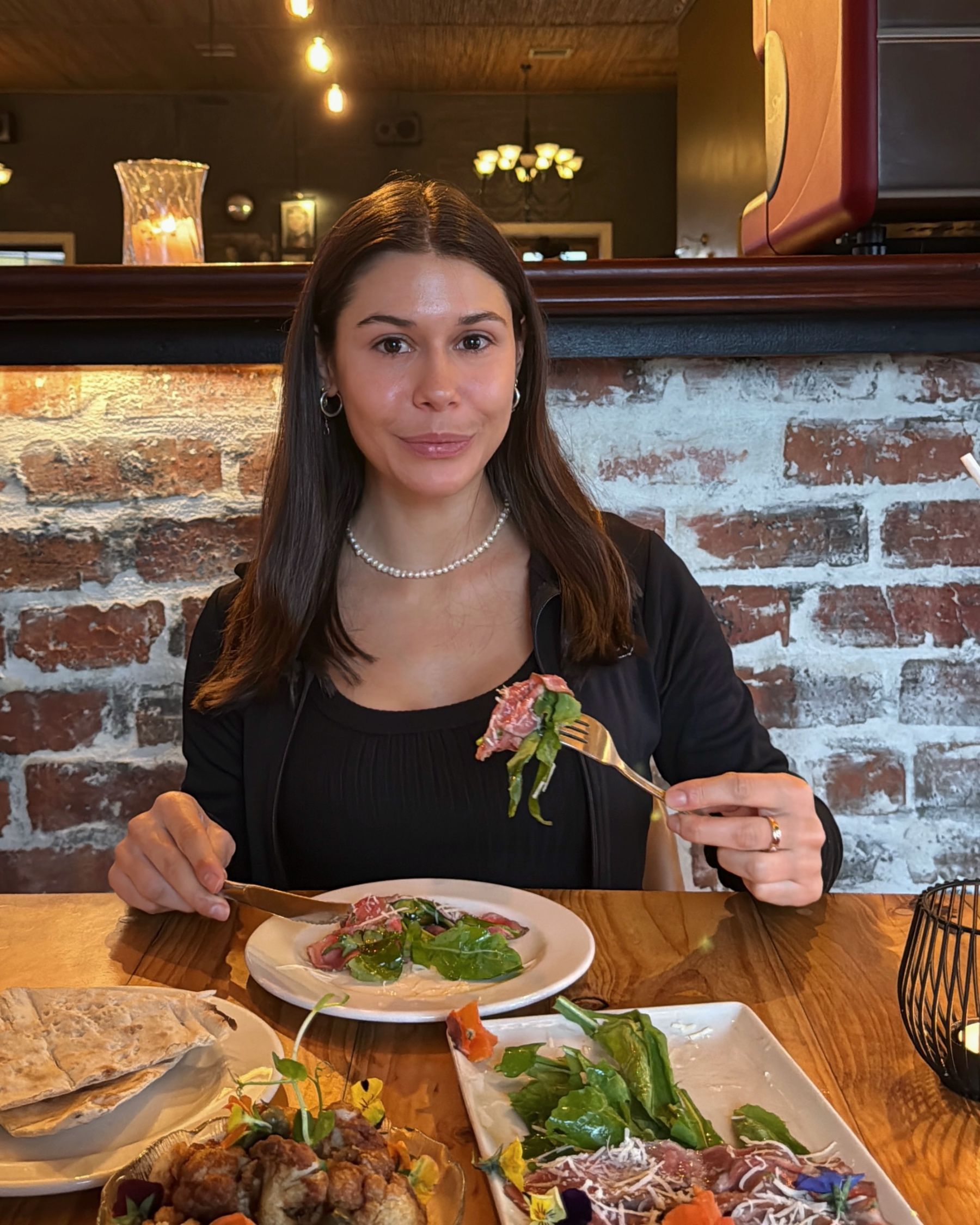 Paige enjoying the beef carpaccio.
