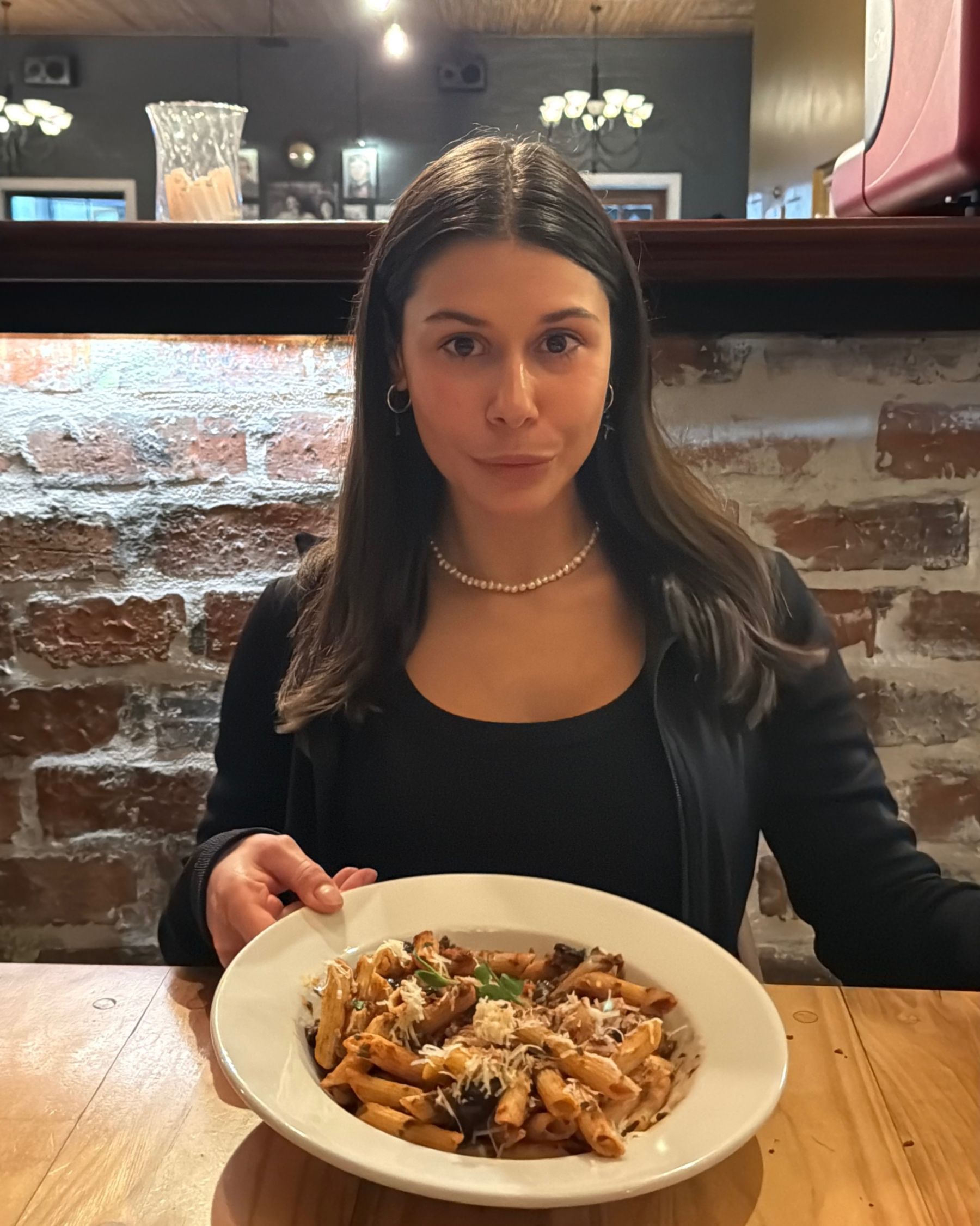 Paige enjoying a bowl of penne puttanesca at Massimo’s.
