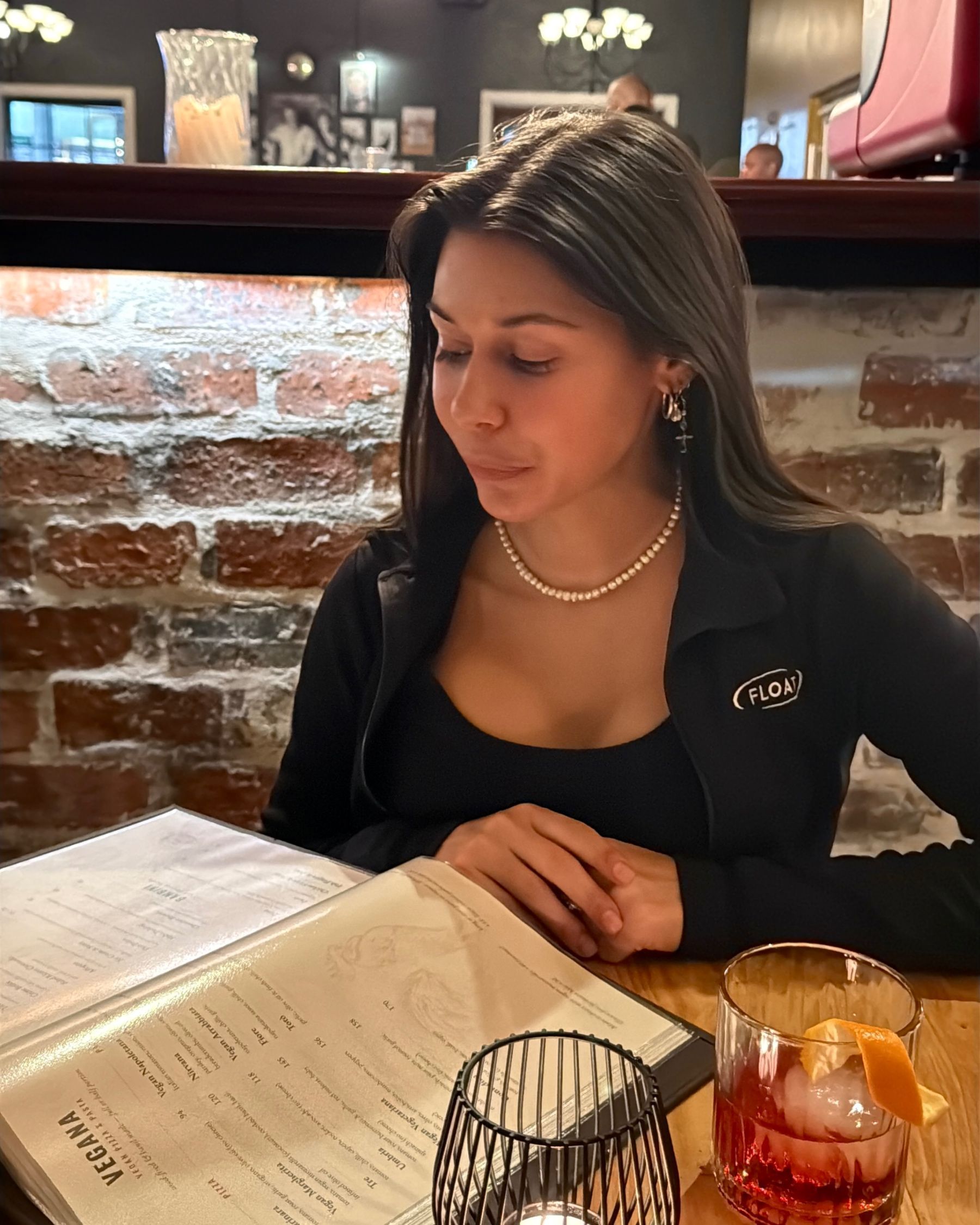 Paige reading the menu before ordering at Massimo’s.
