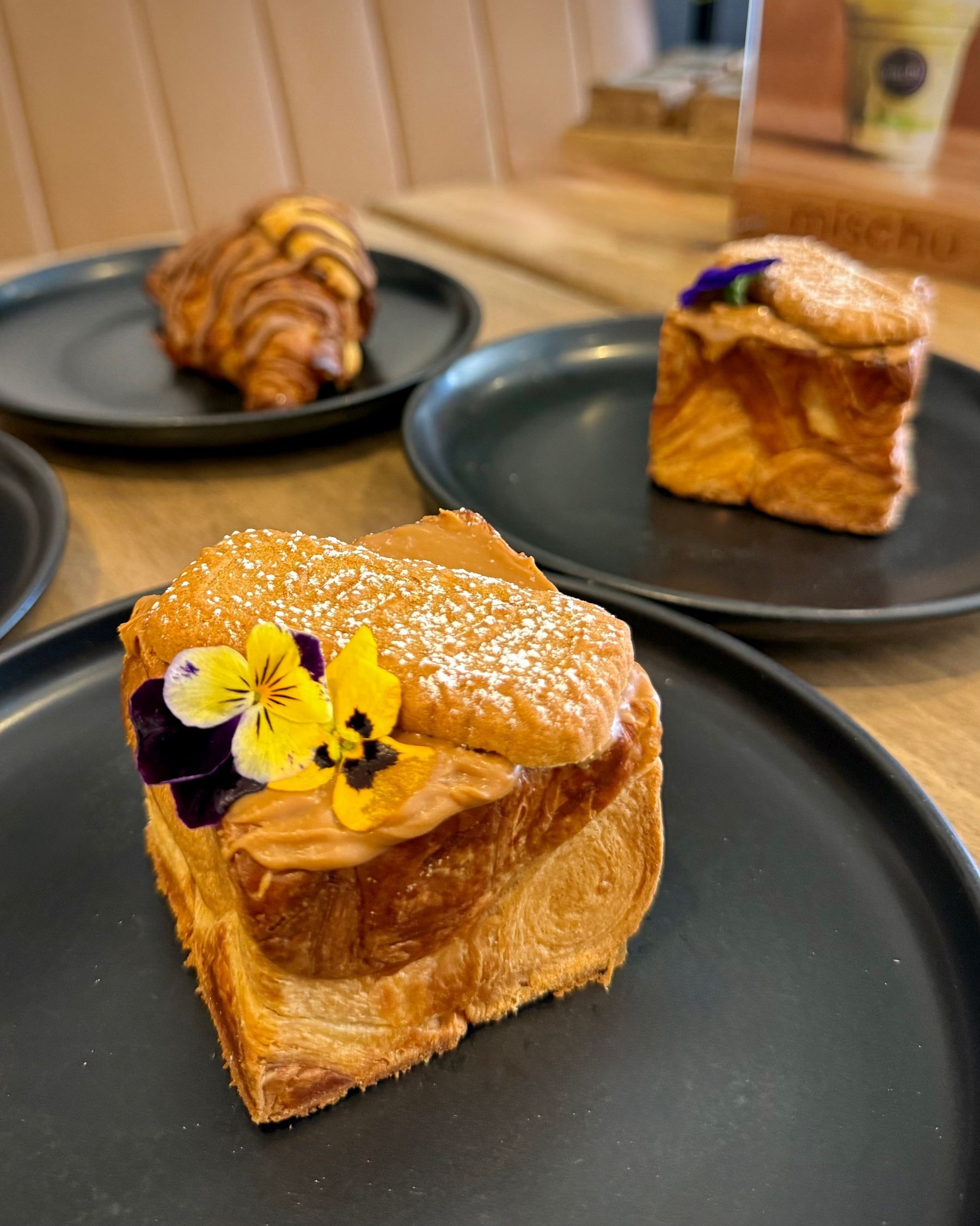 Close-up of Mischu desserts with the flaky Biscoff Cube in the foreground.
