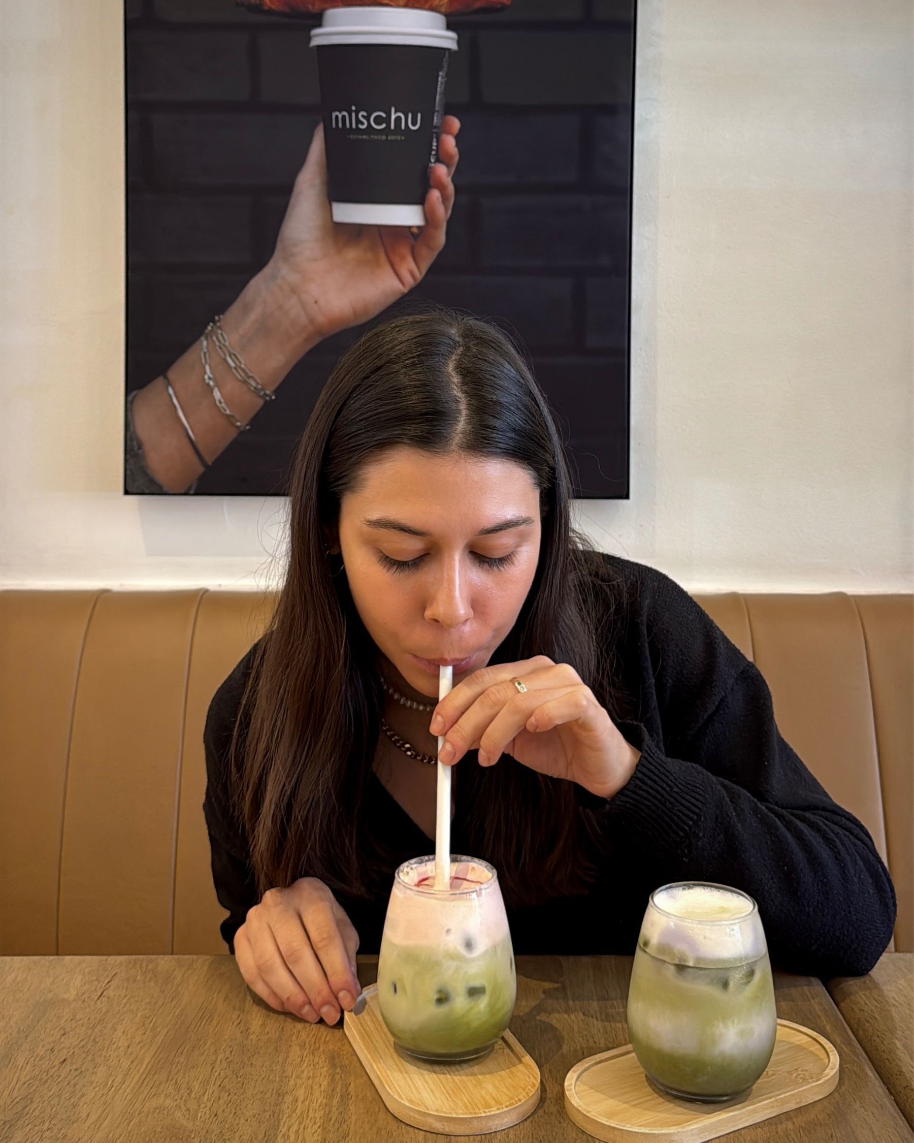 Paige drinking an iced matcha during lunch at Mischu in Sea Point.