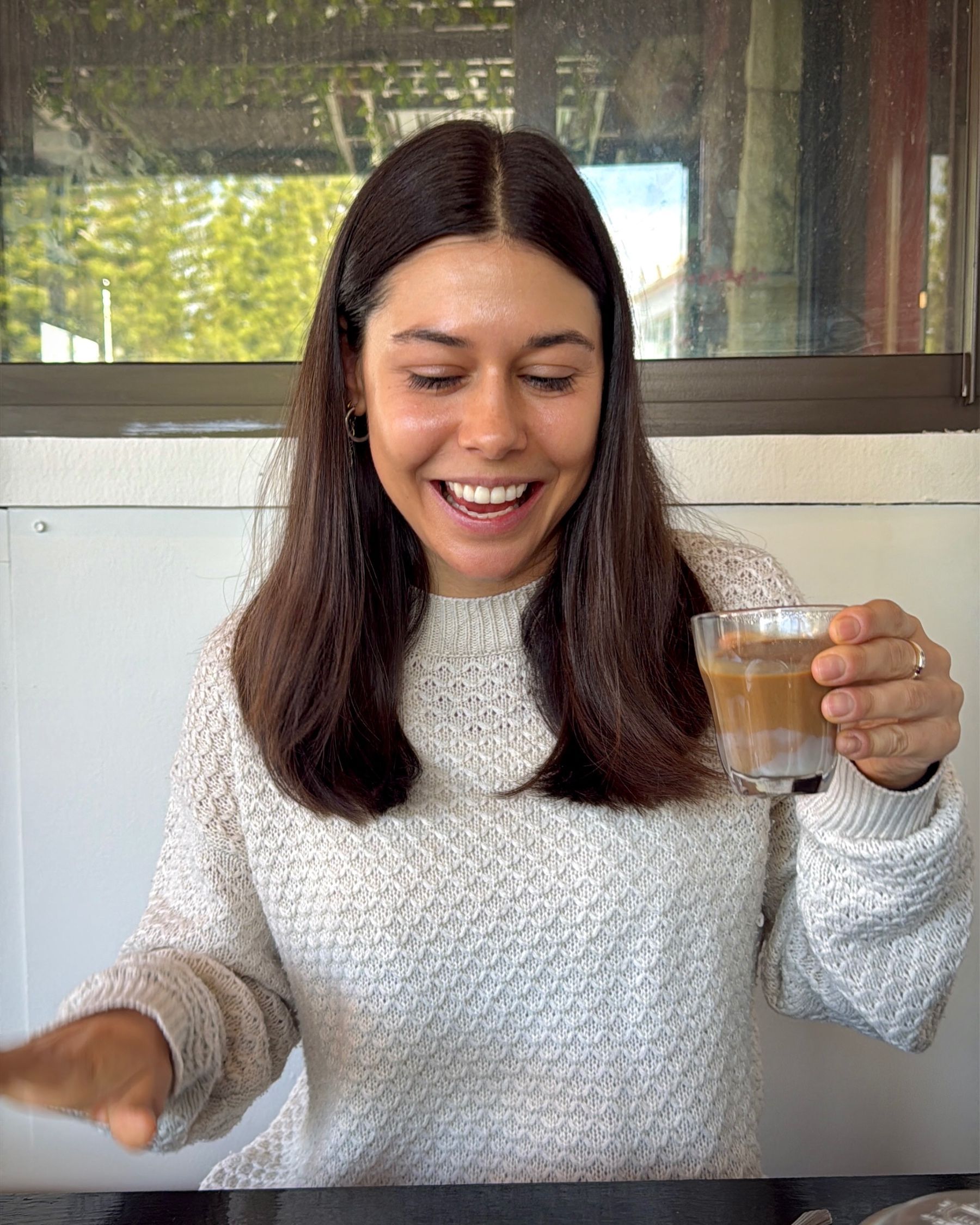 Paige enjoying a traditional Vietnamese coffee at Pho Hue restaurant.