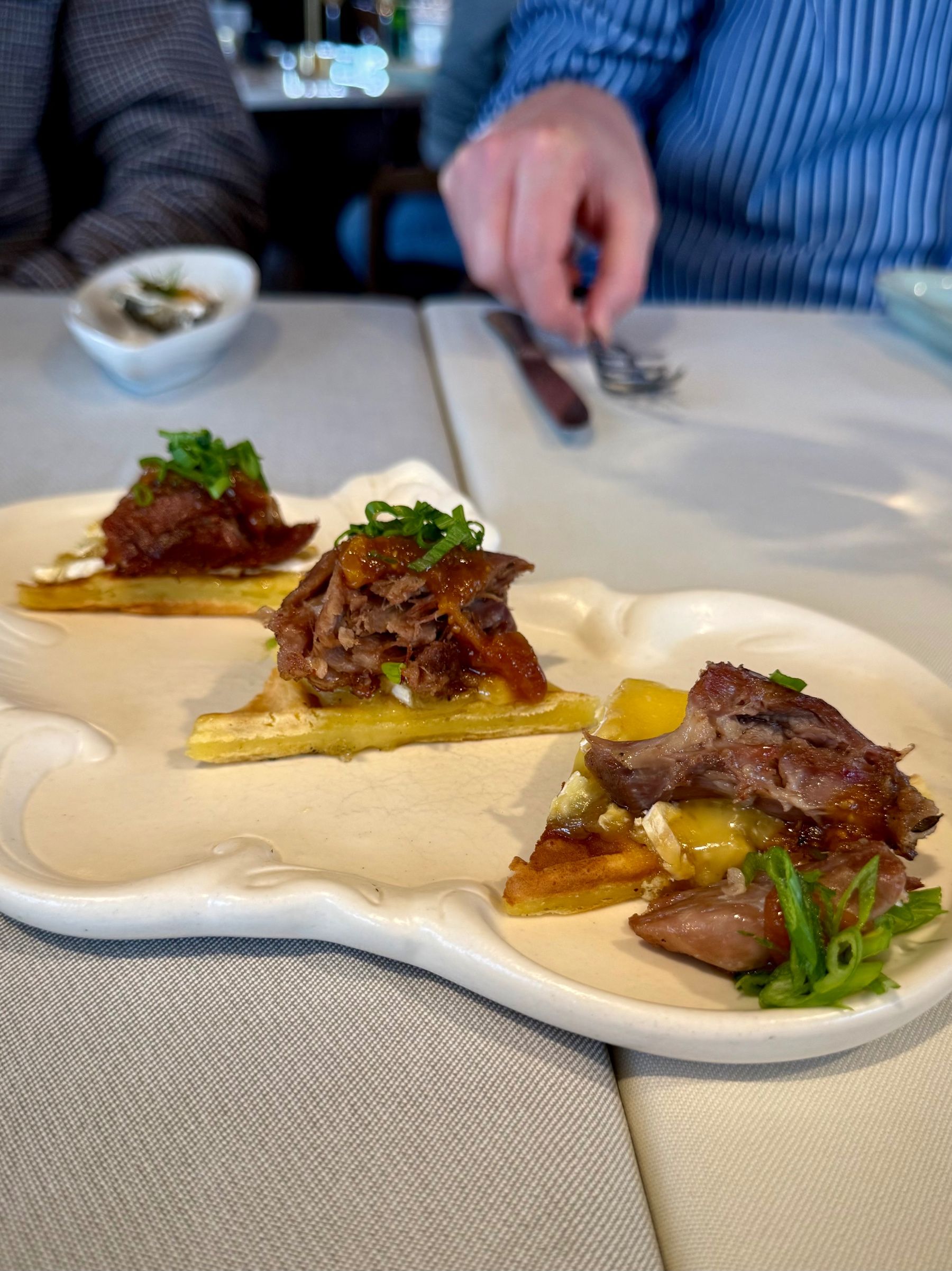 Beef Welly Fridays canapés featuring a bacon jam biscuit and gem squash arancini.