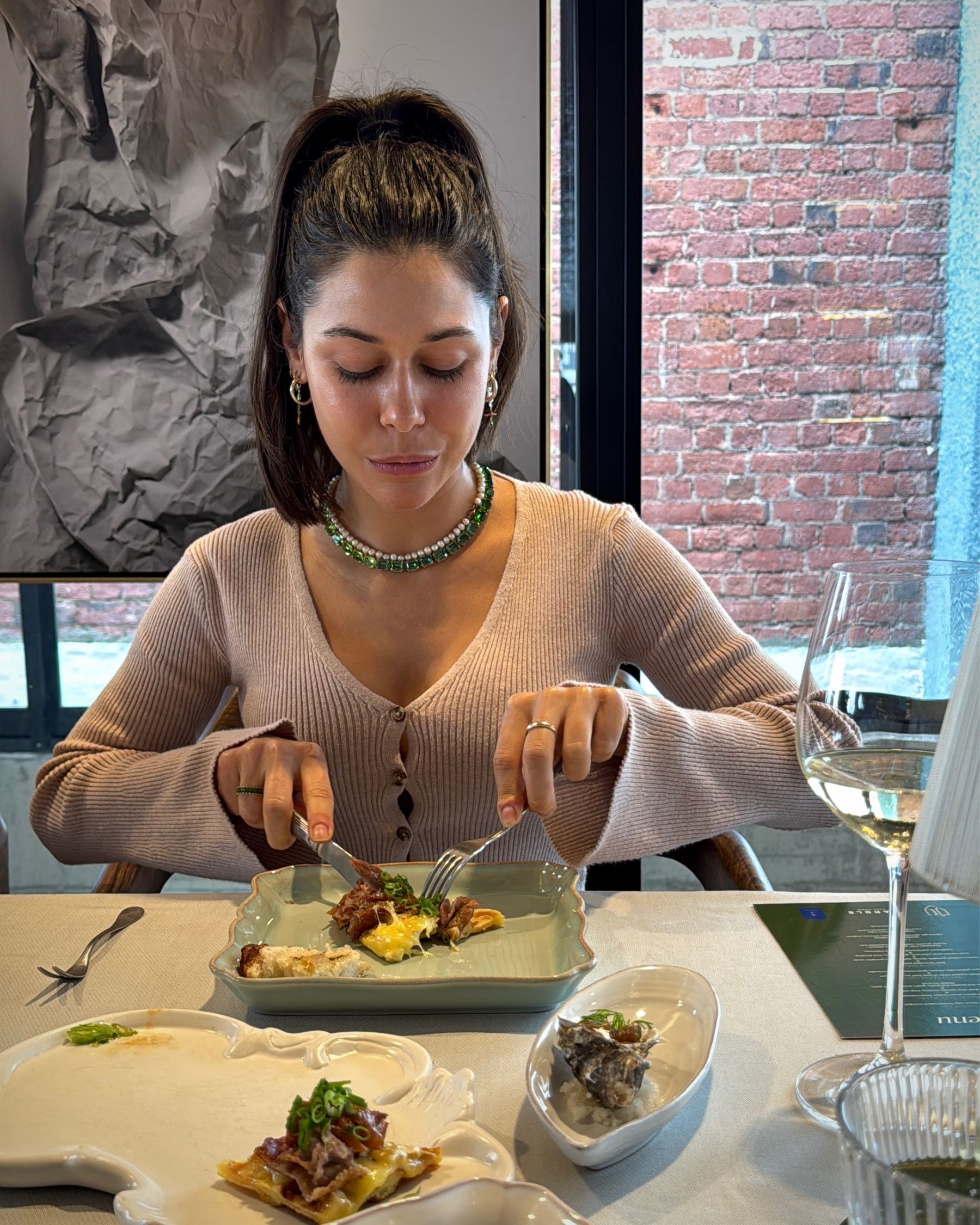 Paige enjoying the gem squash arancini at Grub & Vine.