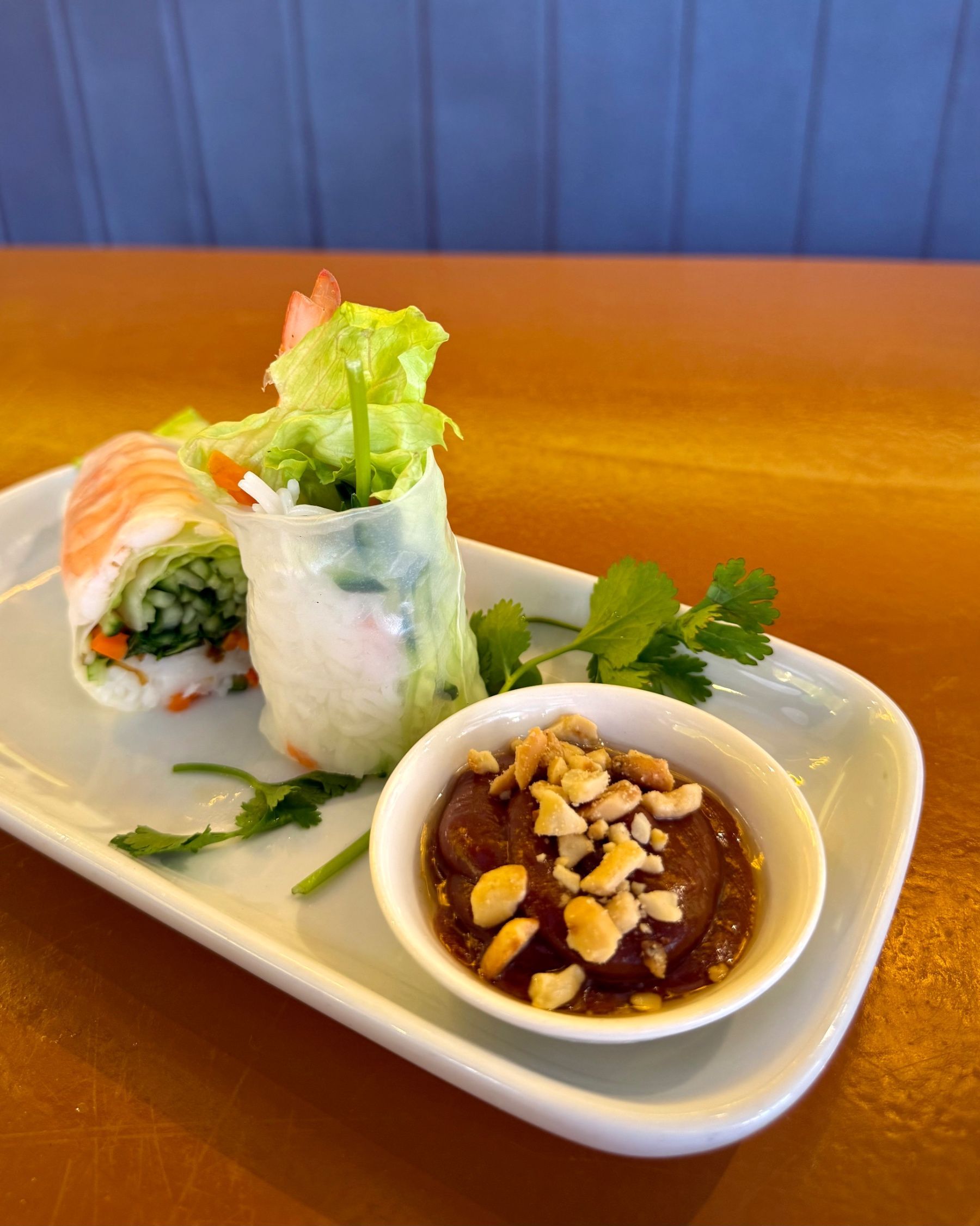 Close-up of the spicy salmon sushi roll at Aiko Sushi Plus.