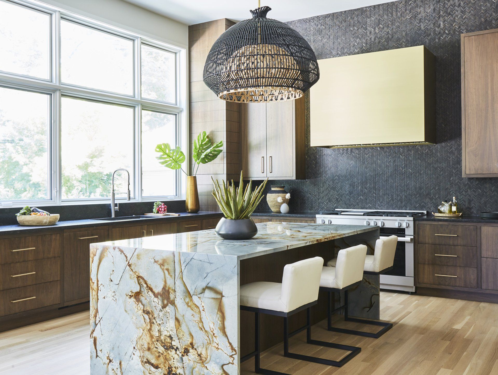 A kitchen with a large island in the middle of it