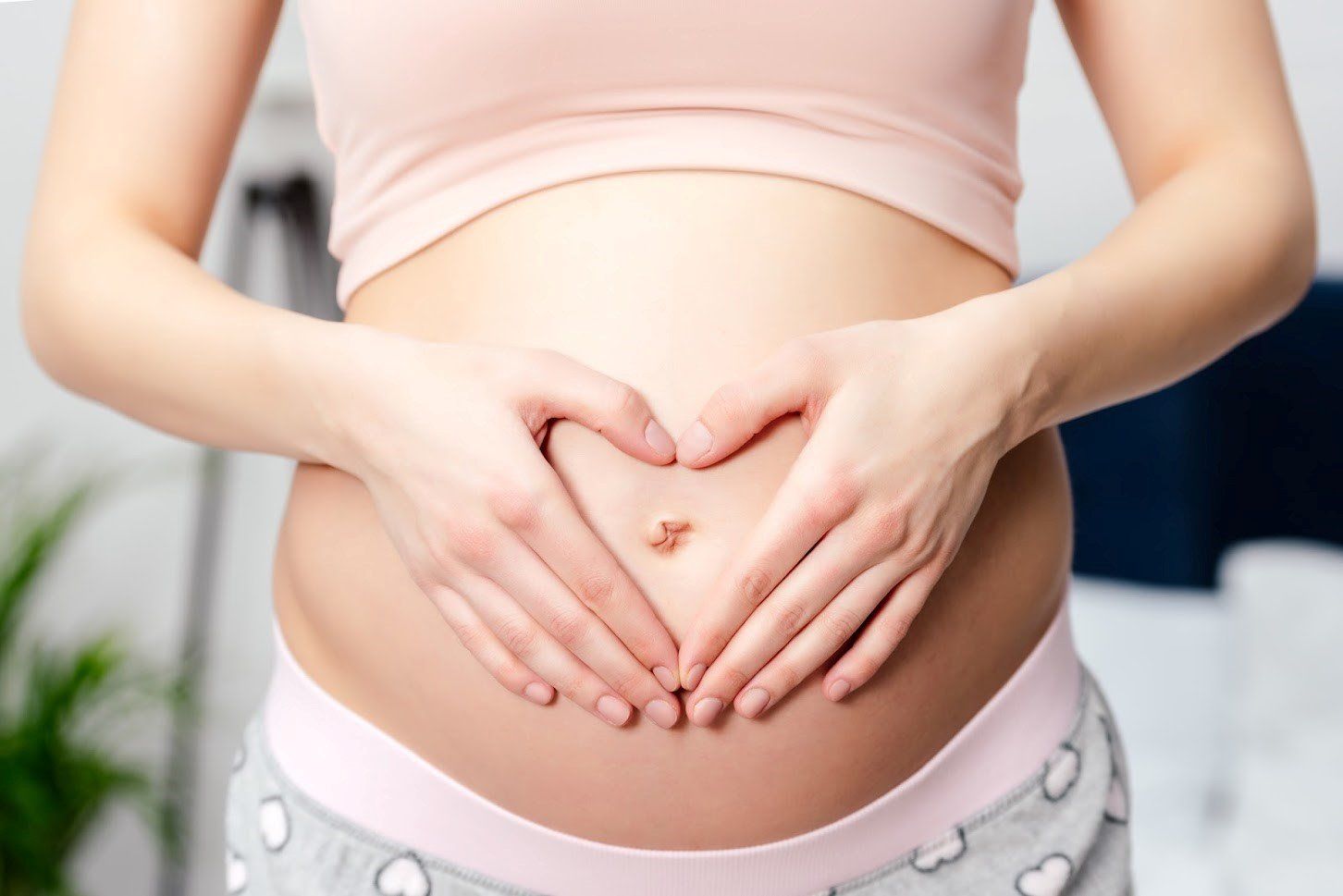 Pregnant Woman Holding Her Tummy — Vienna, VA — Tysons Self Storage Pregnant Woman Holding Her Tummy — Vienna, VA — Tysons Self Storage